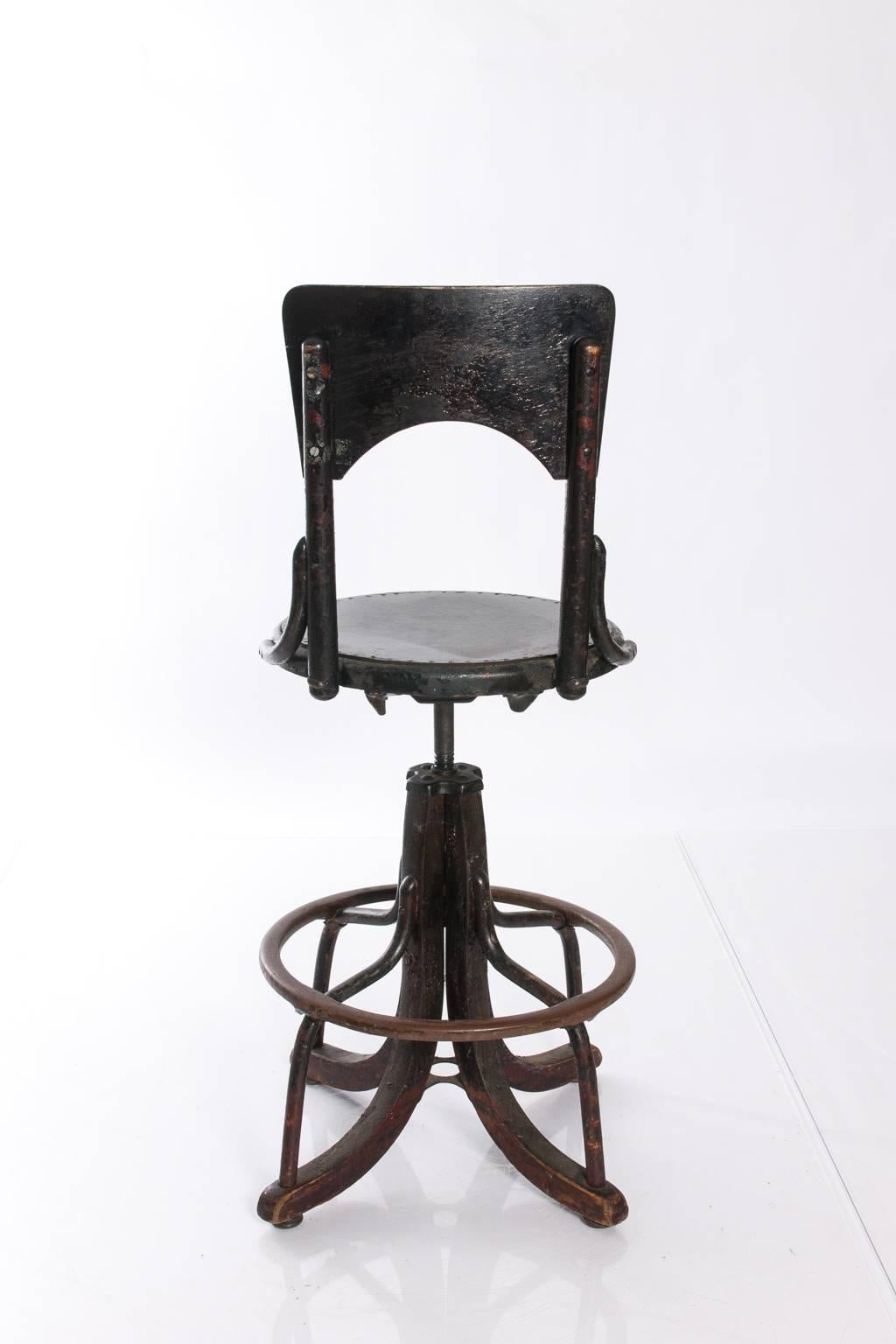 Tall adjustable Industrial stool.
