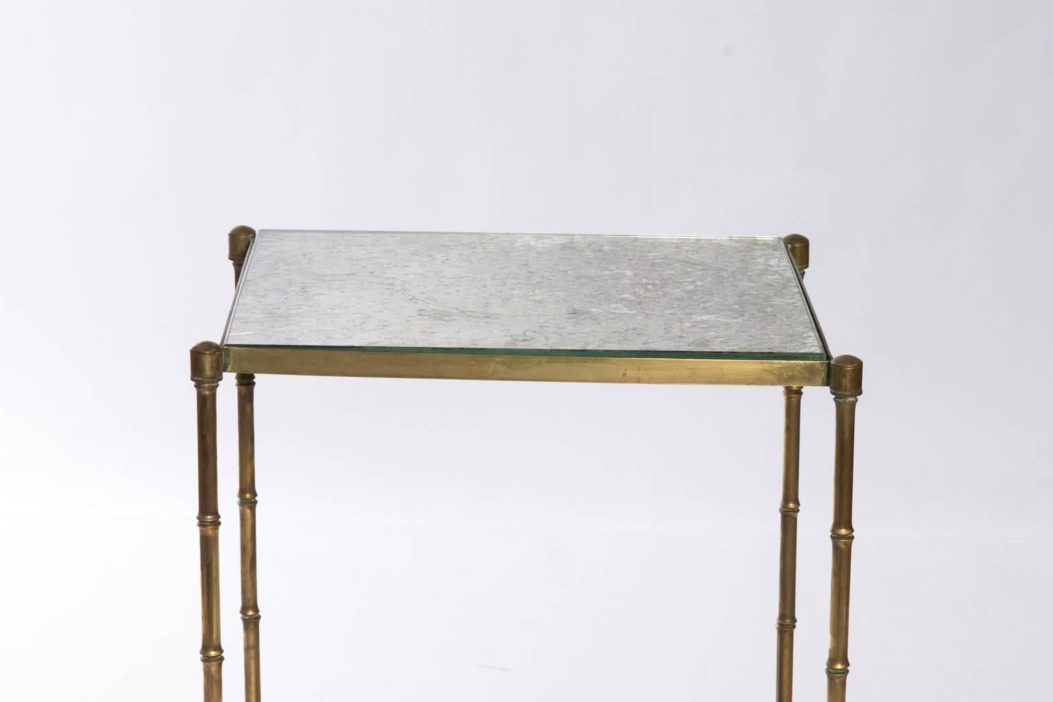 Tiered brass and mirror side table.
 