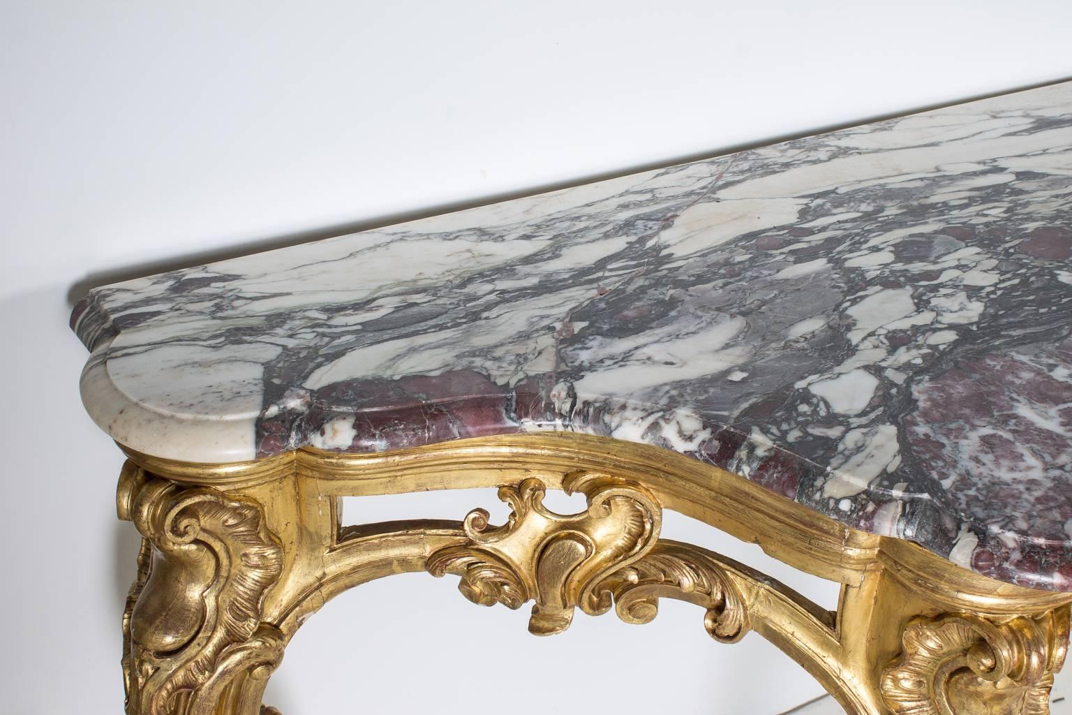 19th century French marble top console with gold gilt.
 