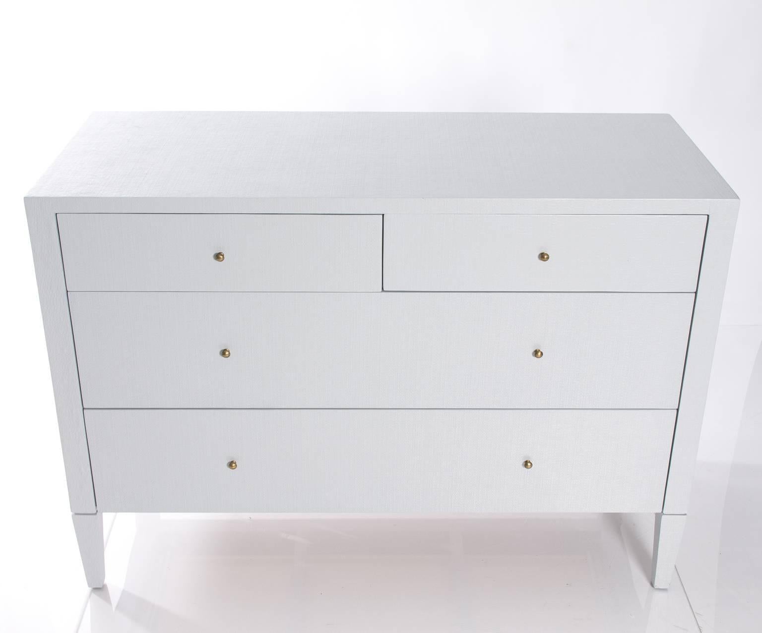 Grey-white chest of drawers.
 