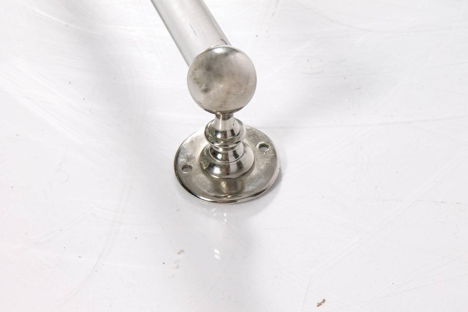 Antique glass towel bar with on fancy ends.
 