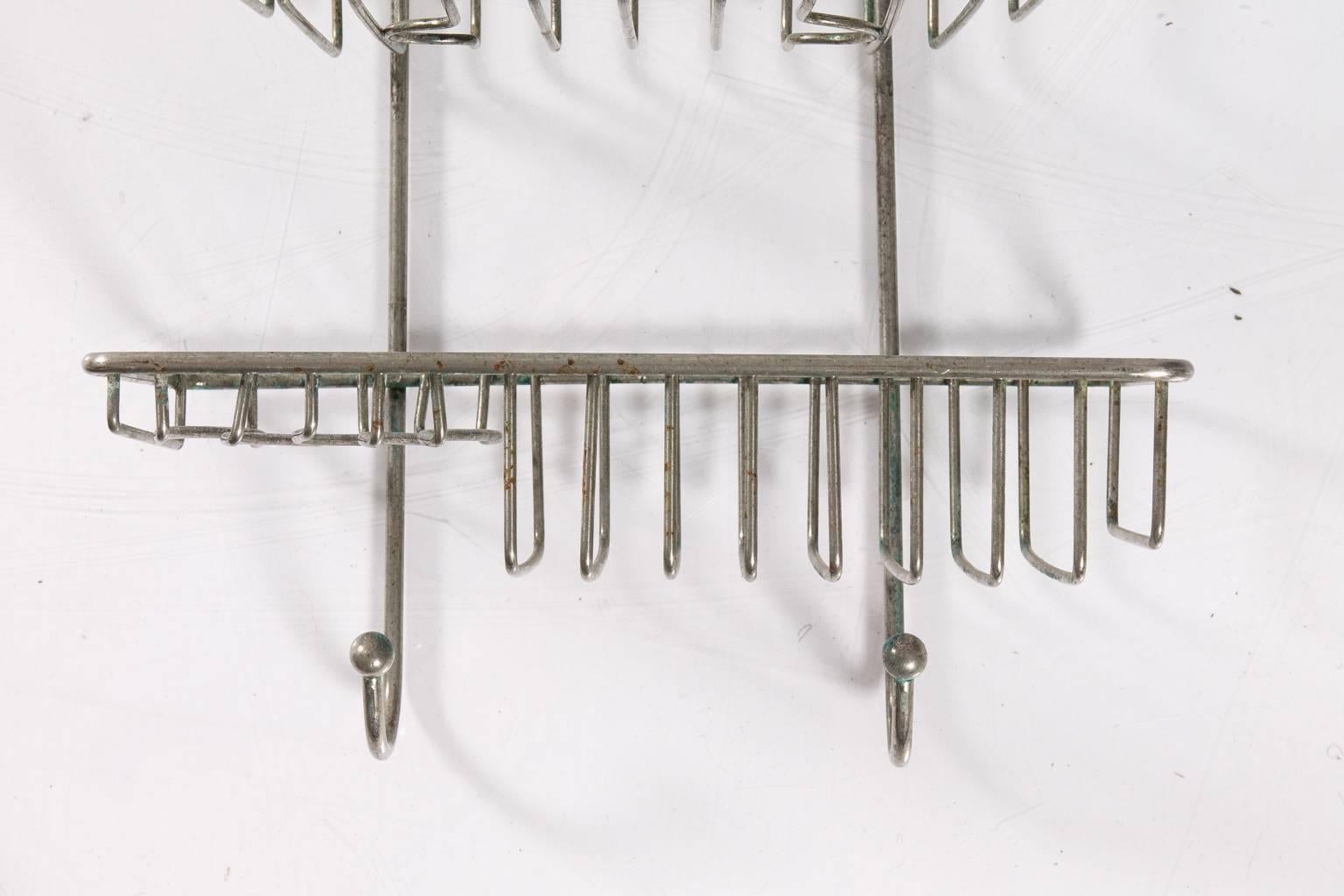 Shower caddy with three shelves and hooks.
 