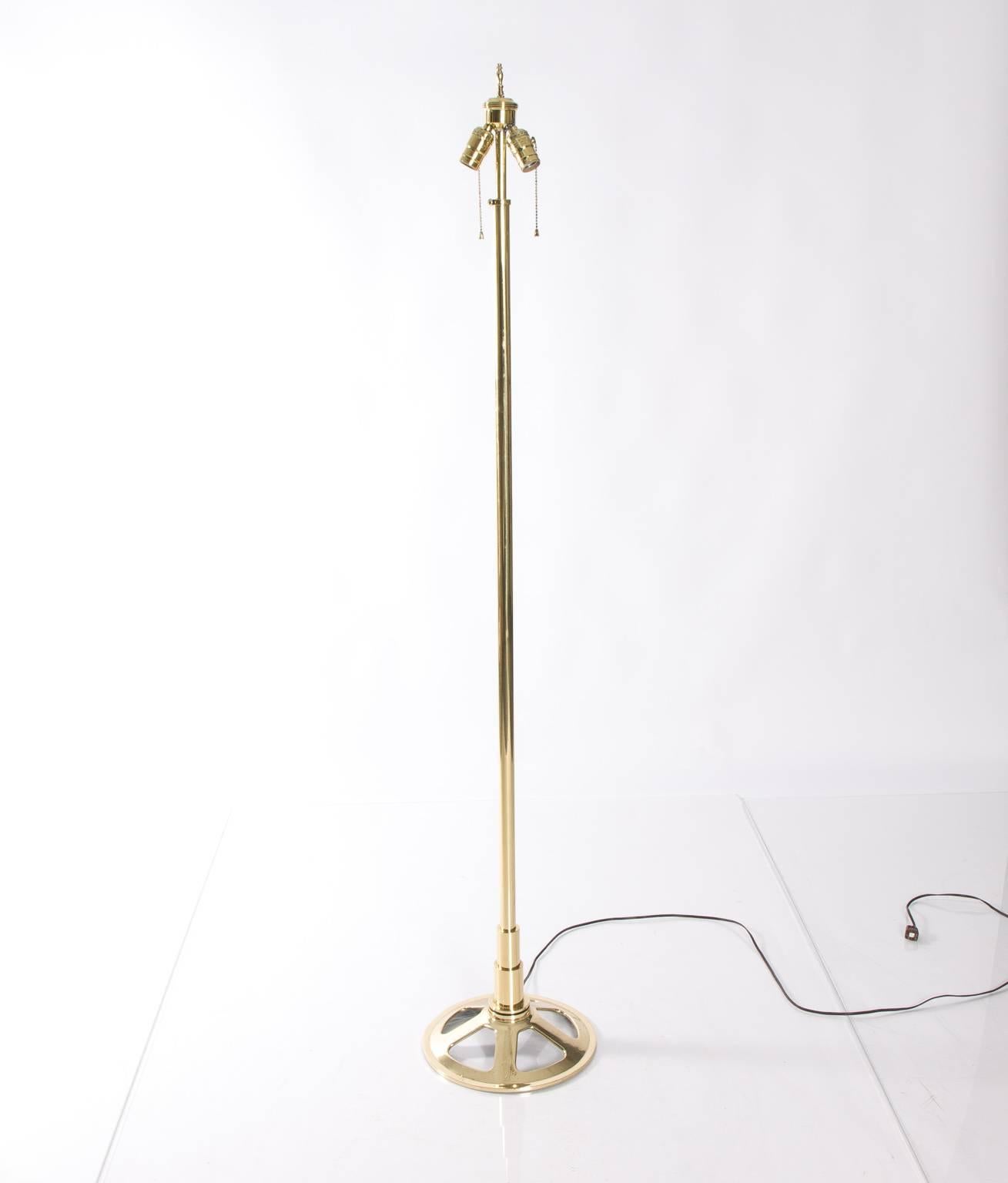 Heavy Industrial style brass floor lamp. Shade not included.
        