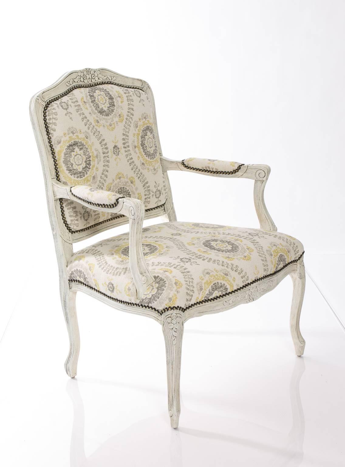 Louis XV style painted open armchair with woven silk and cotton Indian Mughal flower fabric.