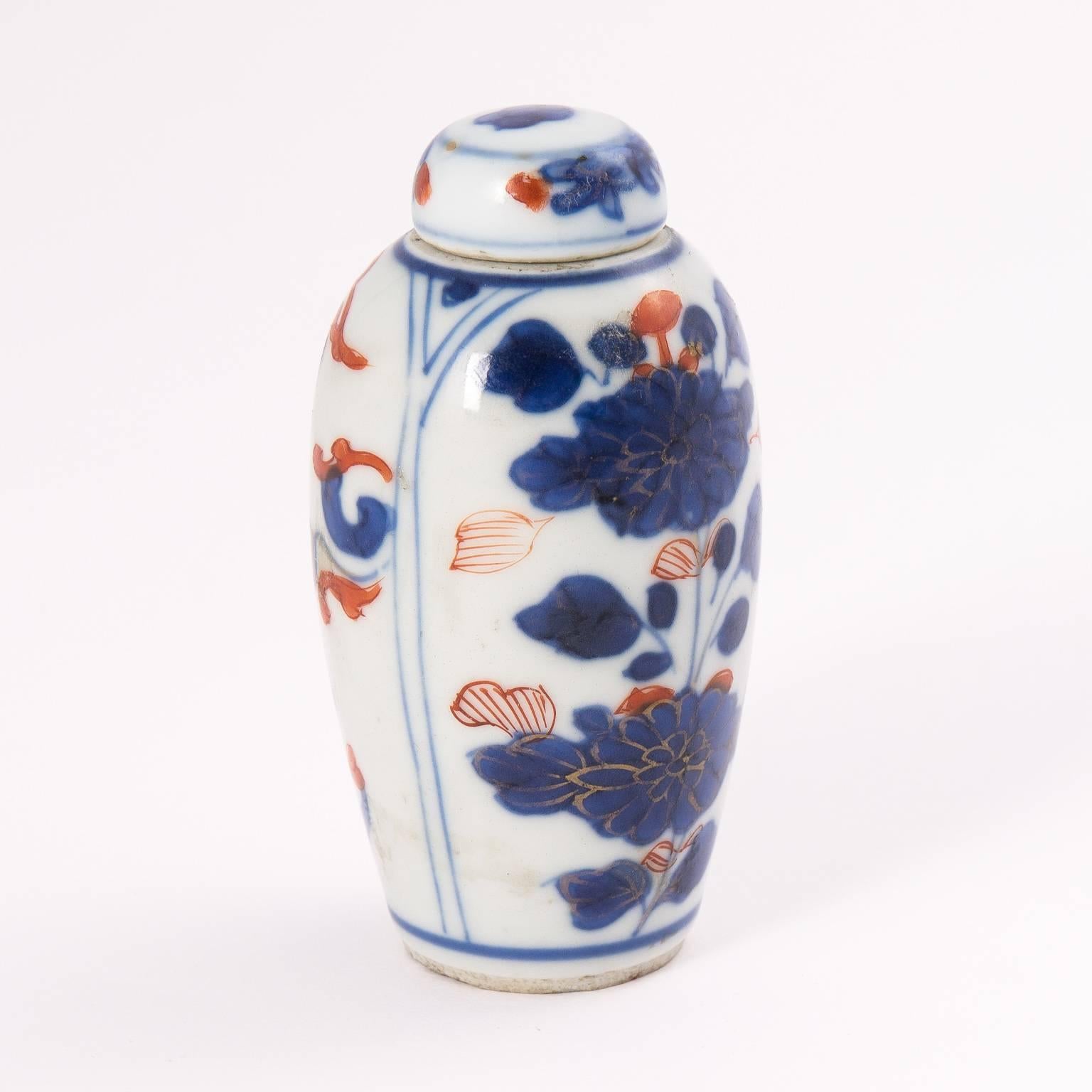 Imari minature vase with matching cover.
  