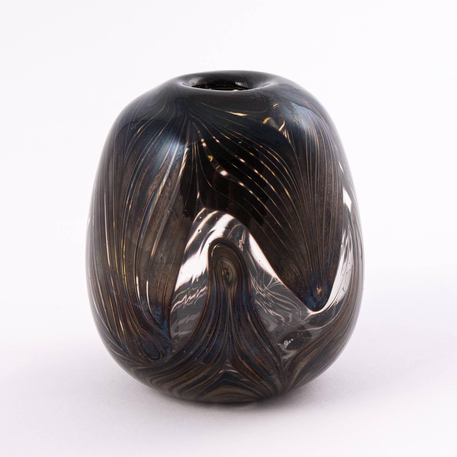 Early 20th century Studio Art Glass vase with peacock feather like pattern.
 