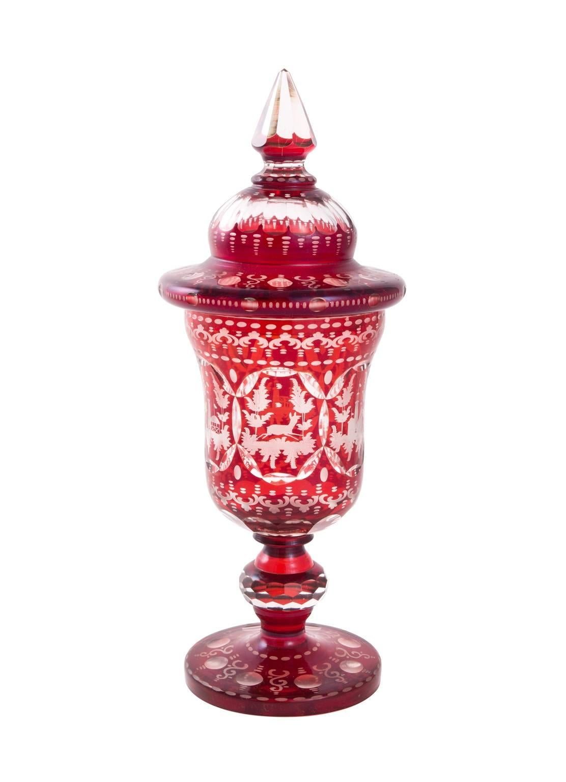 Pair of etched crystal urns with matching covers.
 