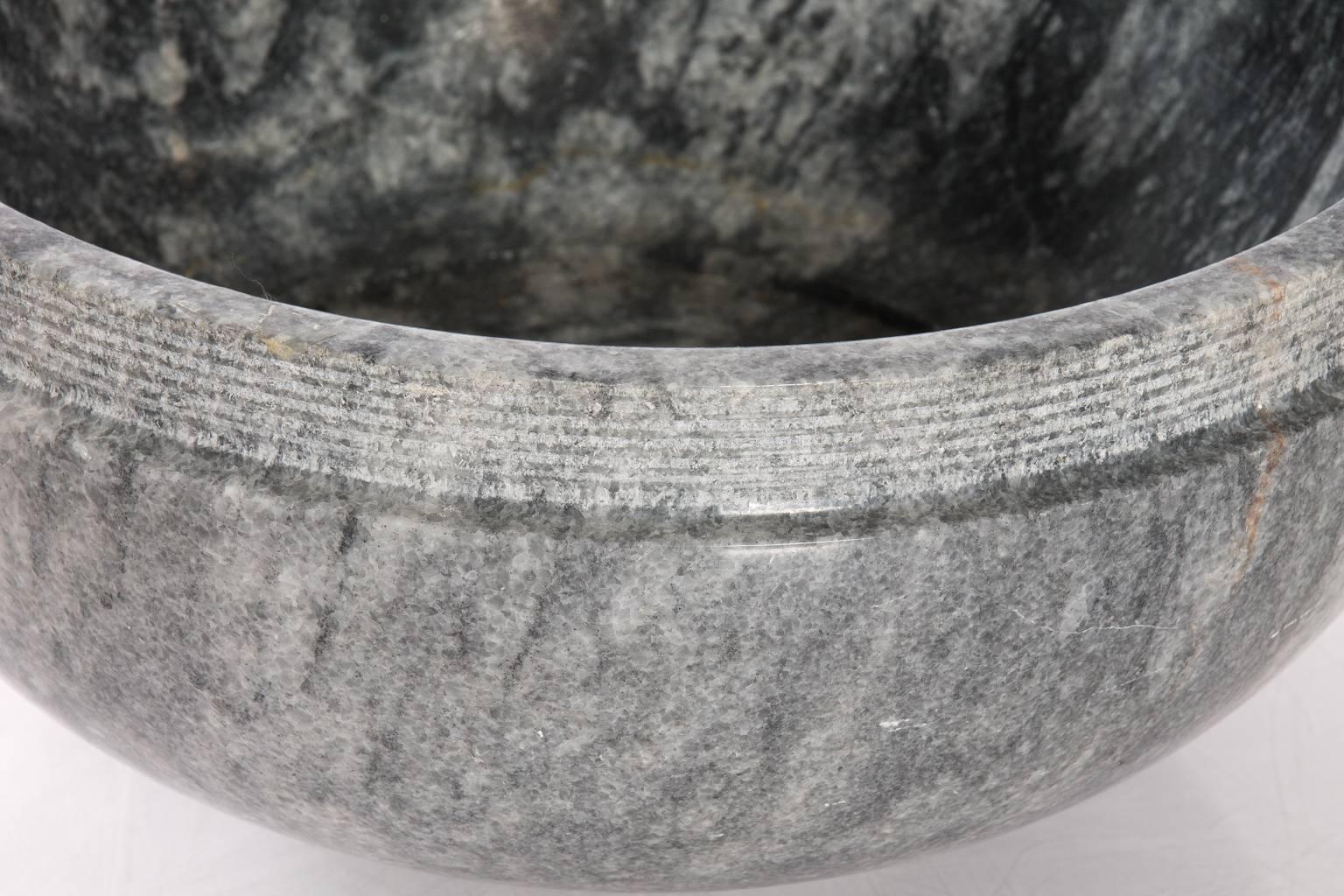 Textured marble bowl with ridged rim signed by a Portuguese sculpture Cristina Ataide.
     