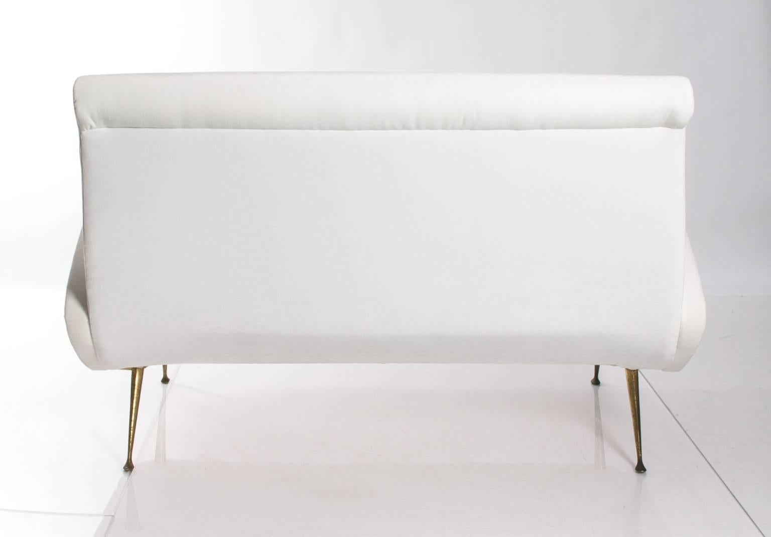 Mid-Century Italian settee freshly upholstered in white velvet.
 
