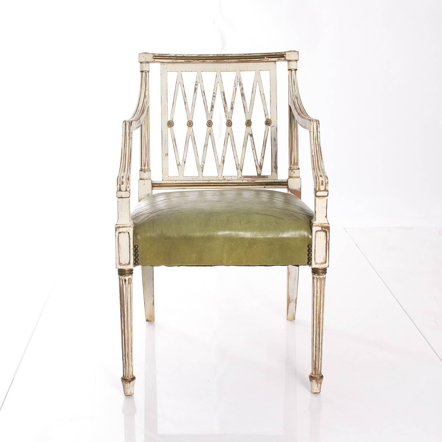Early 20th century painted Regency style open armchair leather seat.
  