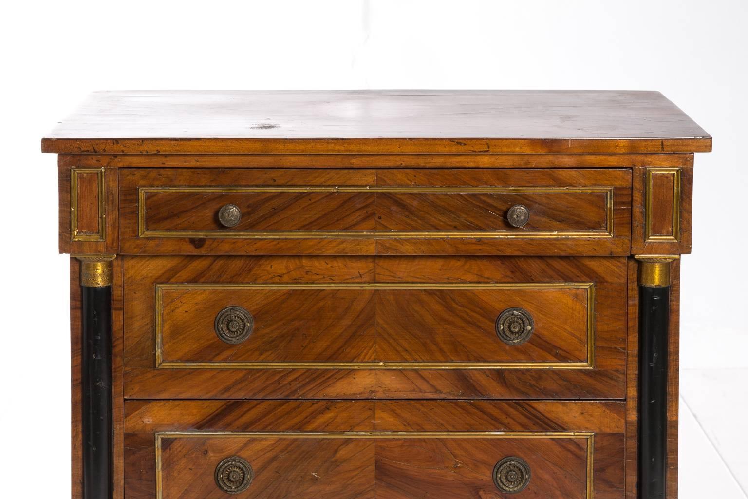 Biedermeier style three-drawer chest with engaged columns.
        