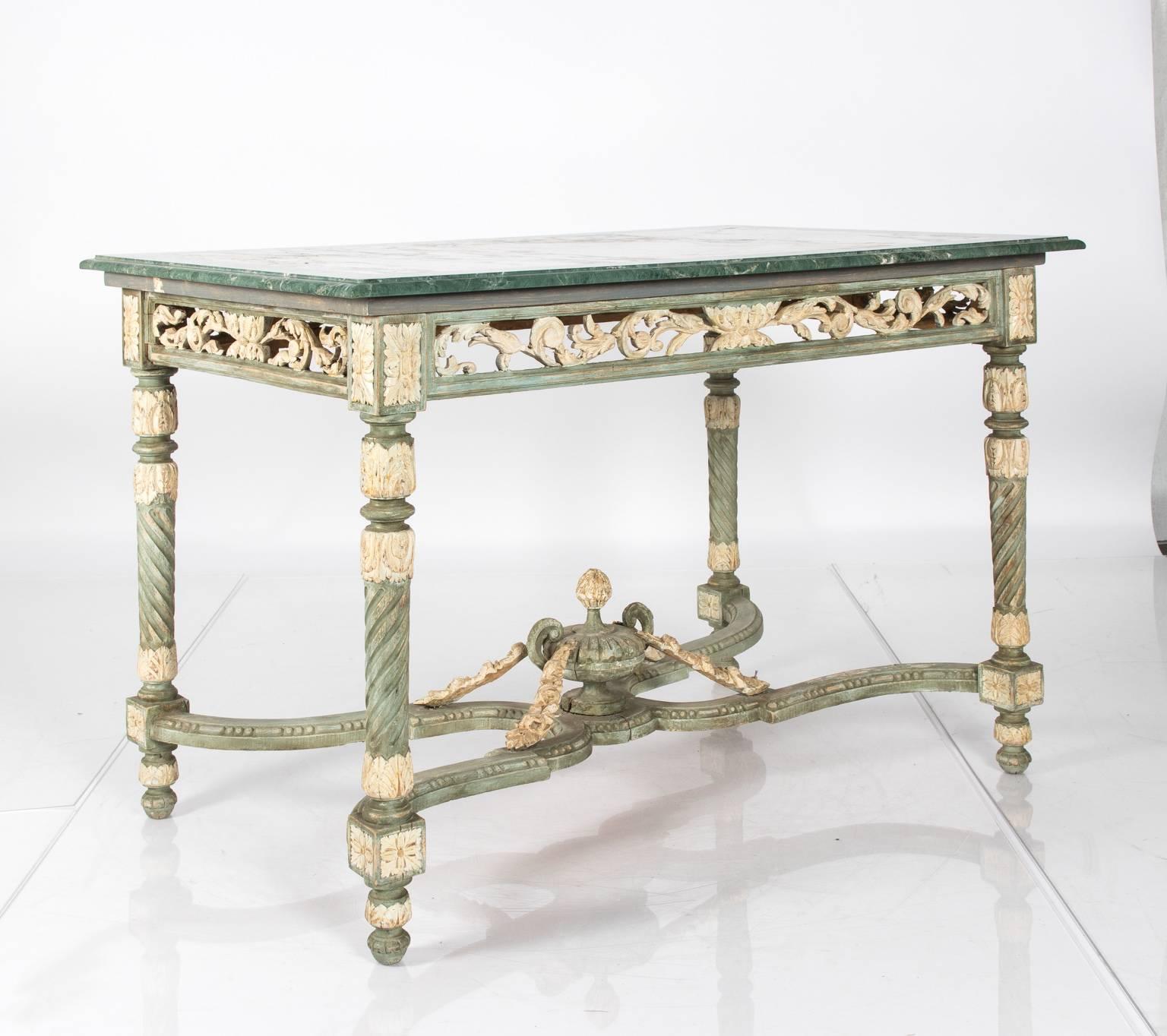 19th century French Napoleon III style table with marble top and carved base.
 
