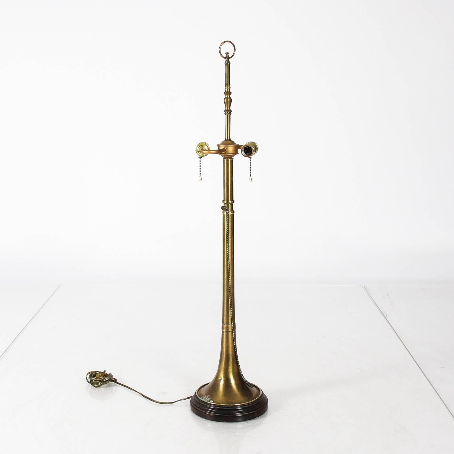 Pair of brass trumpets converted to lamps, circa 20th century.
     