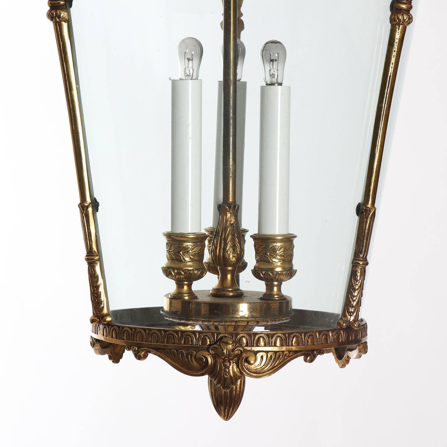 Early 20th century bronze three light lantern with curved glass panes.
 