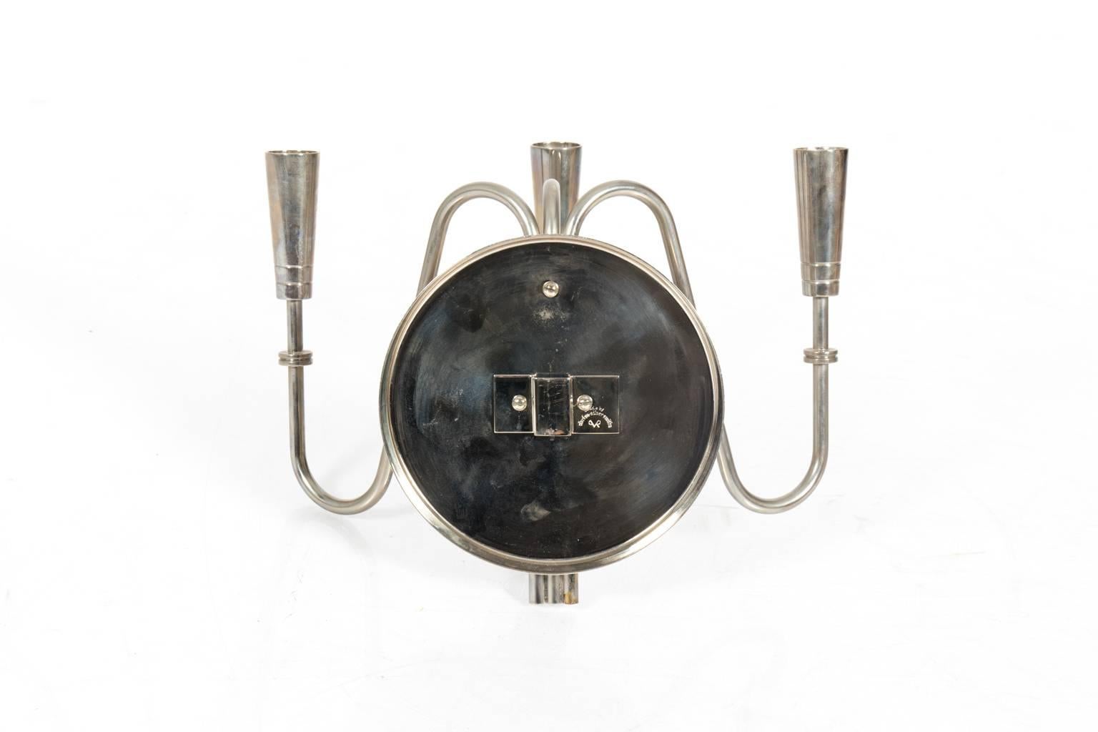 1970s pair of nickel-plated sconces in a manner of Tommi Parzinger.
 