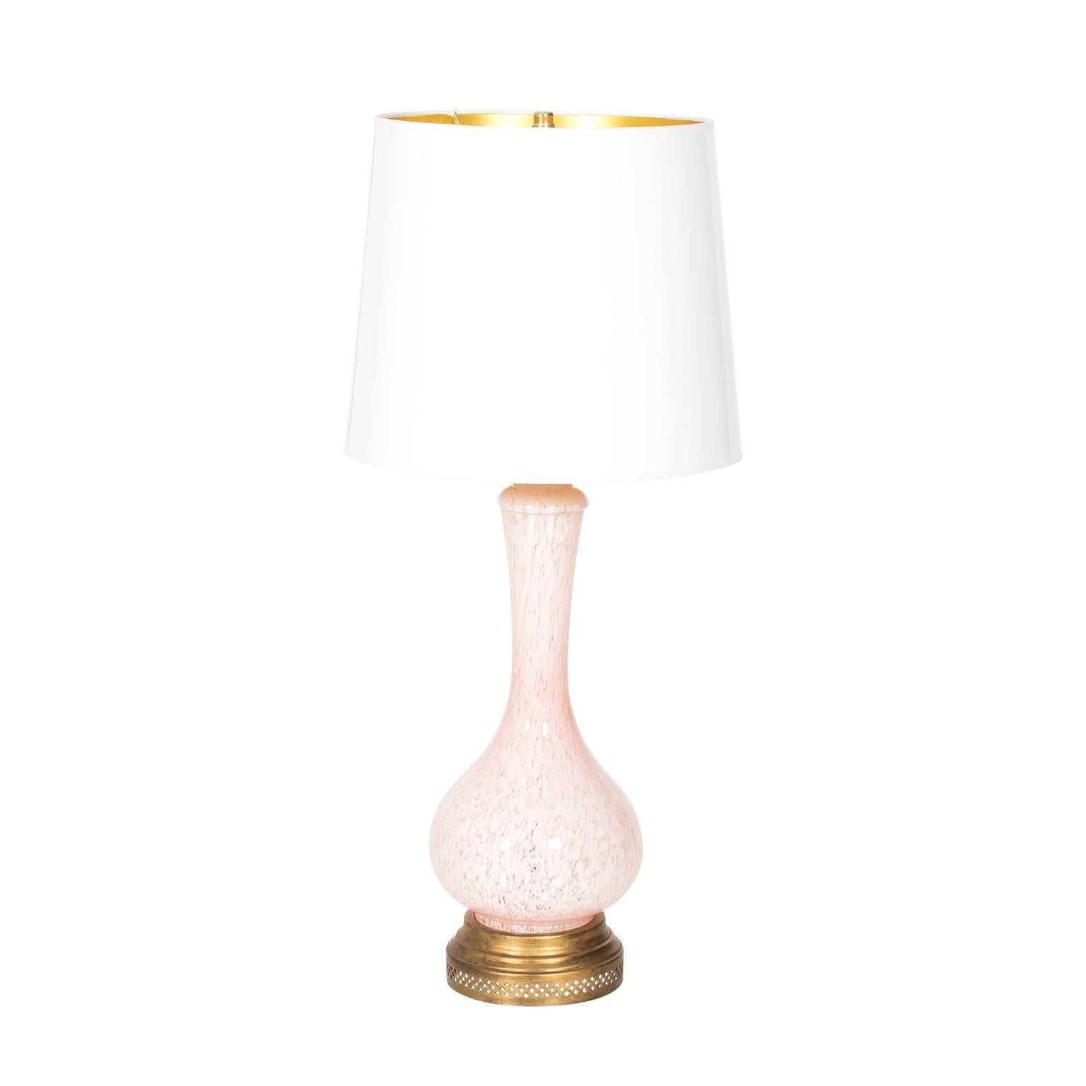 Pair of mid-20th century blush pink Murano glass lamps with a gold gilt base. Newly rewired with shades not included.
 