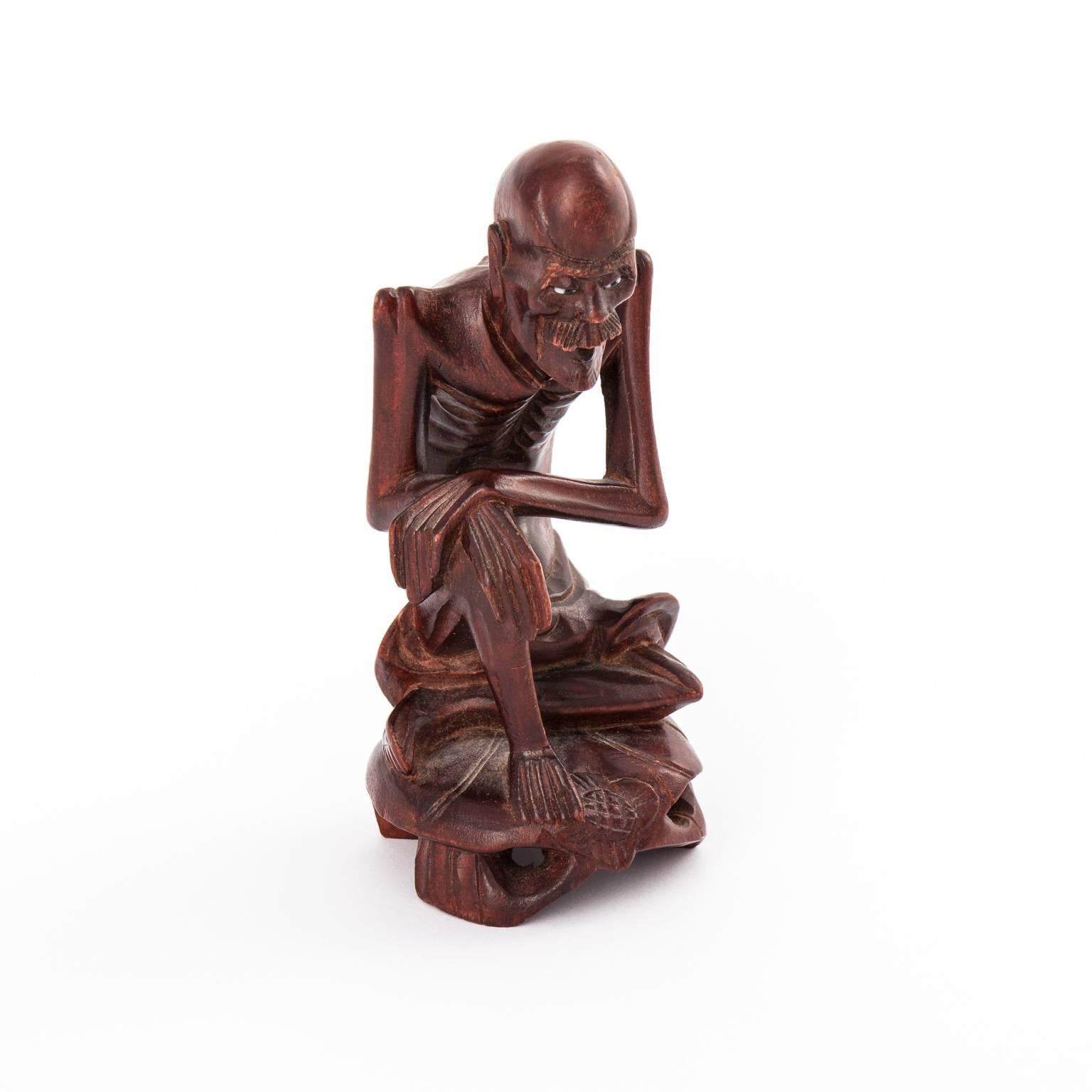 Wood carving of an old man, circa 19th century.
 