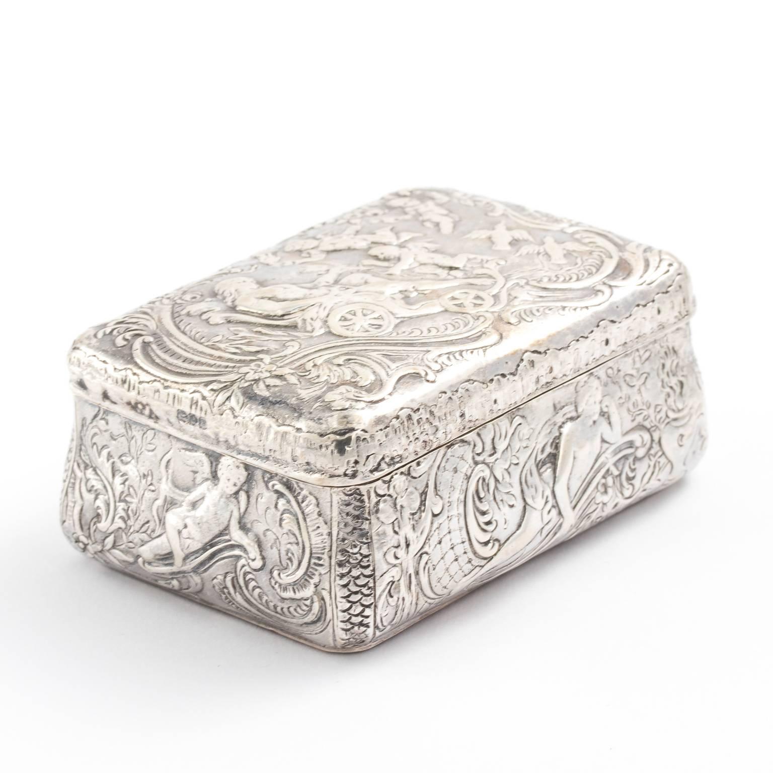 Sterling silver repoussé antique sterling silver trinket or snuff box from England Chester, circa 1900.
 