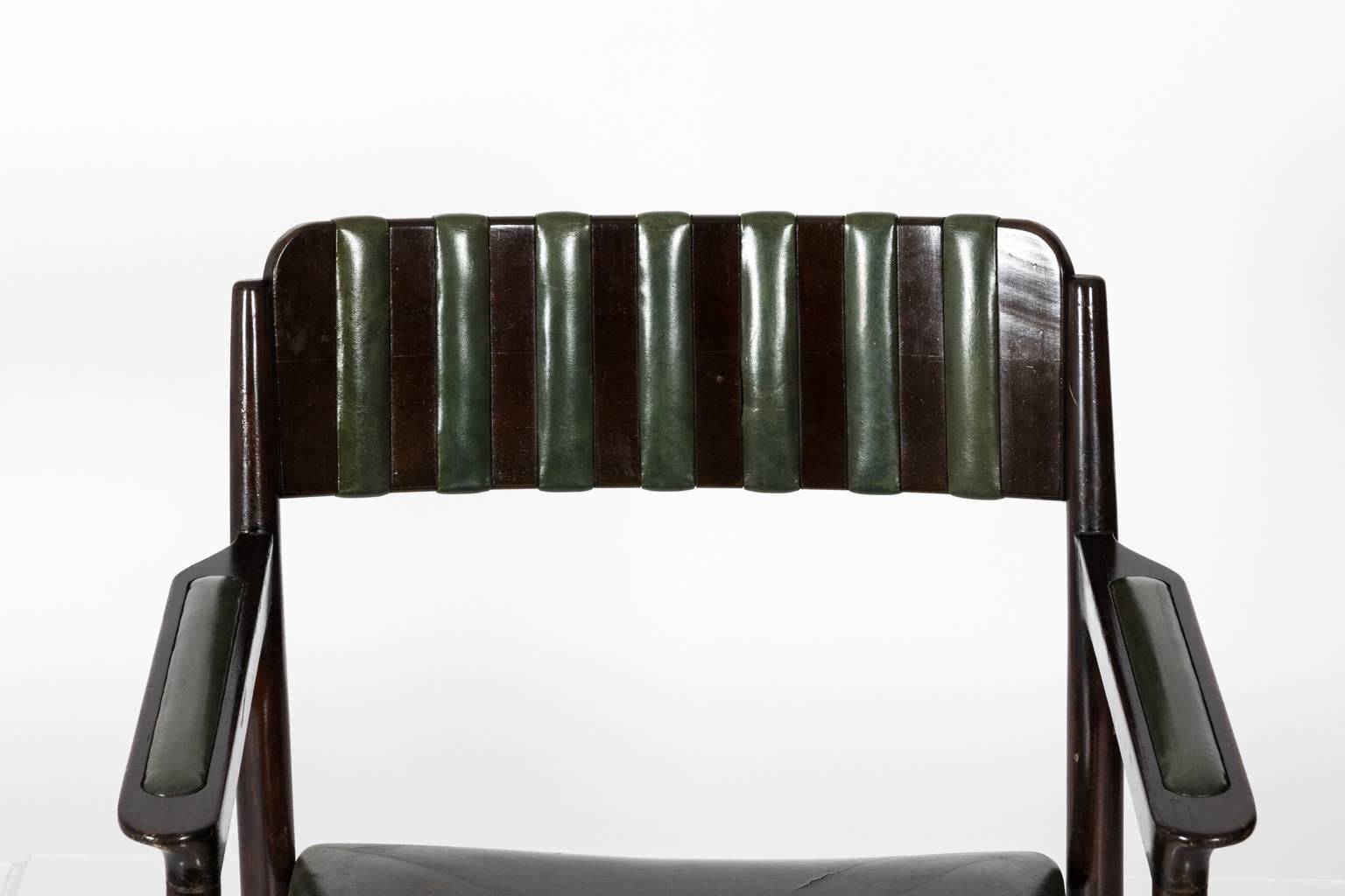 Set of 4 mahogany armchairs with green leather, circa 1940s.  
 