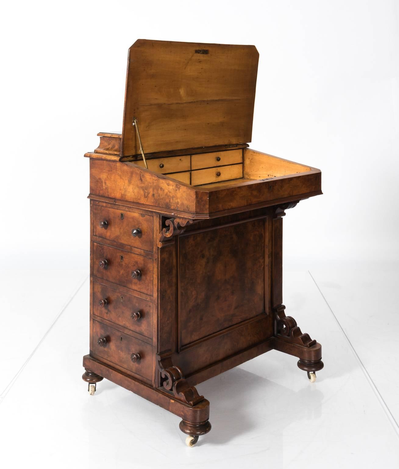 English walnut writing desk with a felted top, circa late 19th century.
  