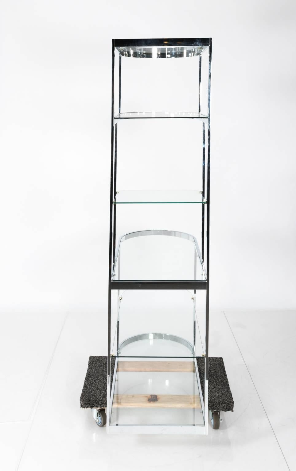 Chrome and glass étagère with rounded sides, circa 1960s.
       