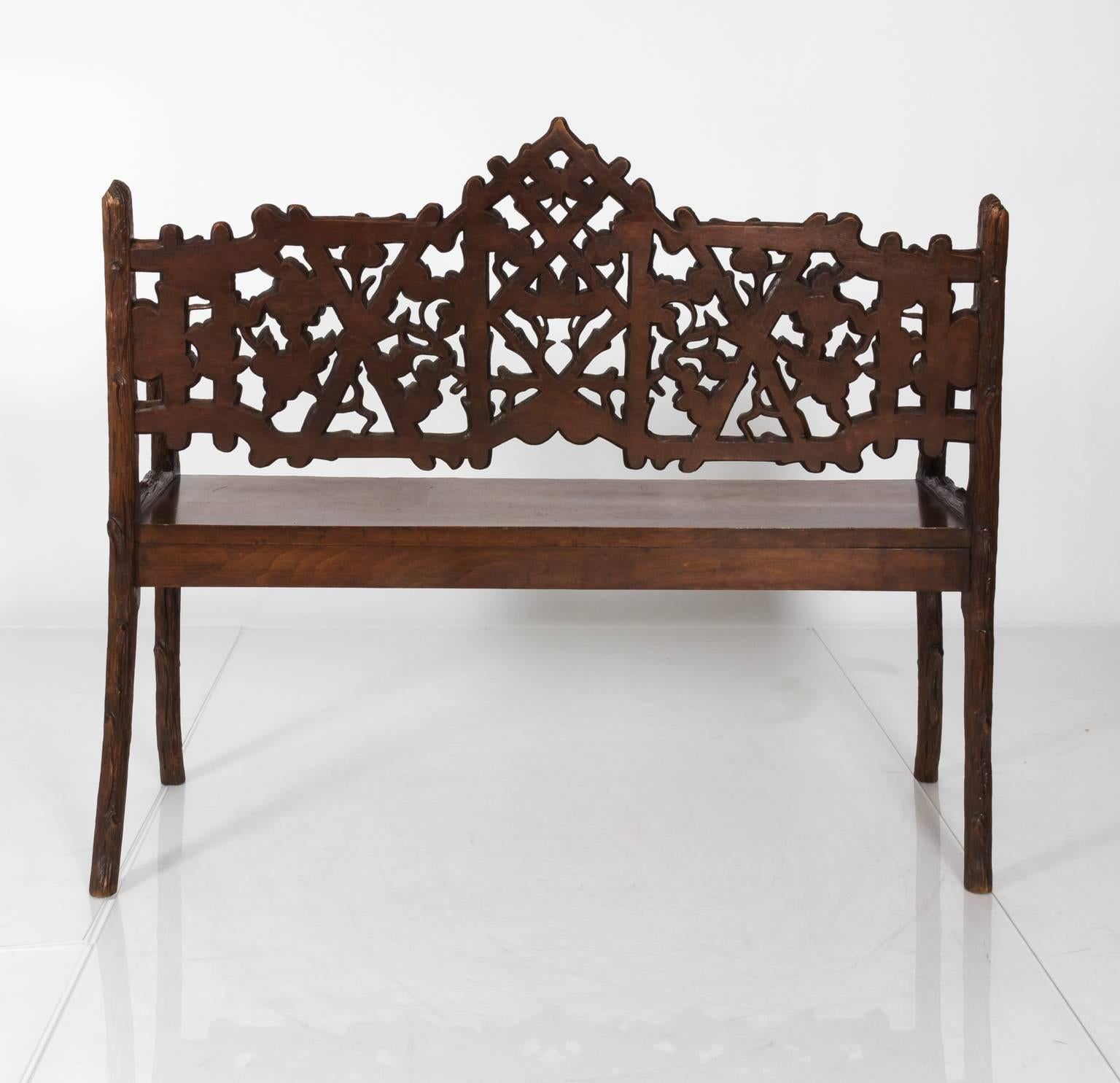 Black forest carved wooden bench, circa 1900s.
 