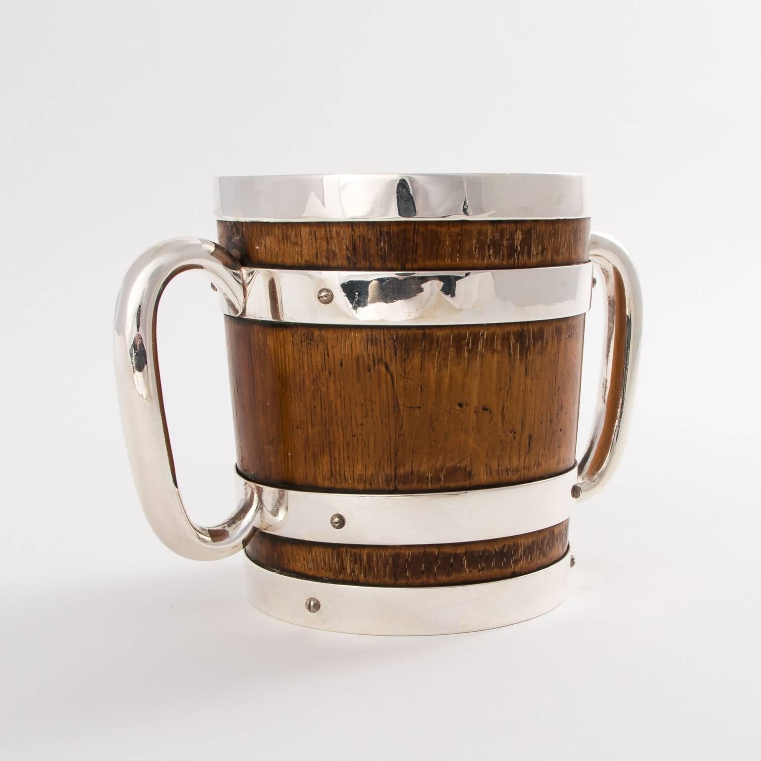 Oak and silver plated ice pail, circa 1920.
 