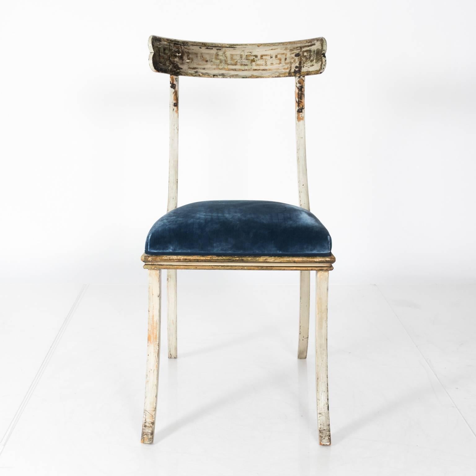 Swedish klismos chairs, circa late 19th century.
Circa late 19th century Swedish klismos chairs  with blue velvet seats and features traces of original gilt paint with Greek key detailing on the back”  Condition:  Stains to velvet.  Paint is worn in