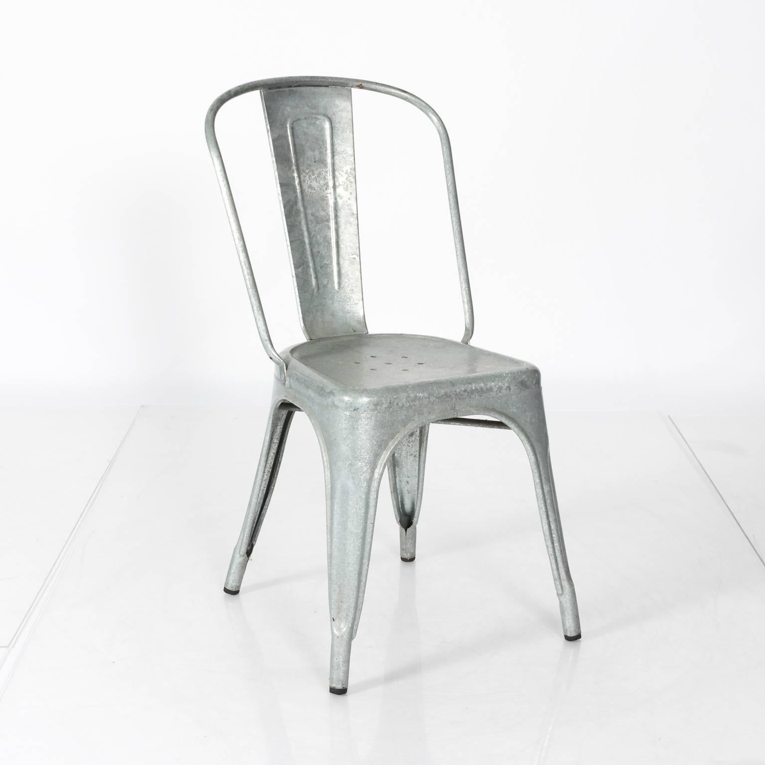 Pair of Industrial silver metal chairs.
   
