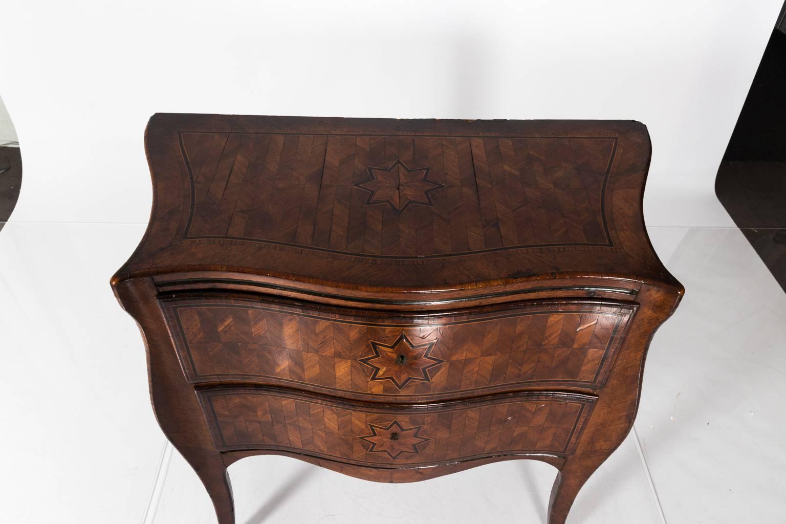 Two-drawer chest with starburst marquetry, circa 18th century.
 