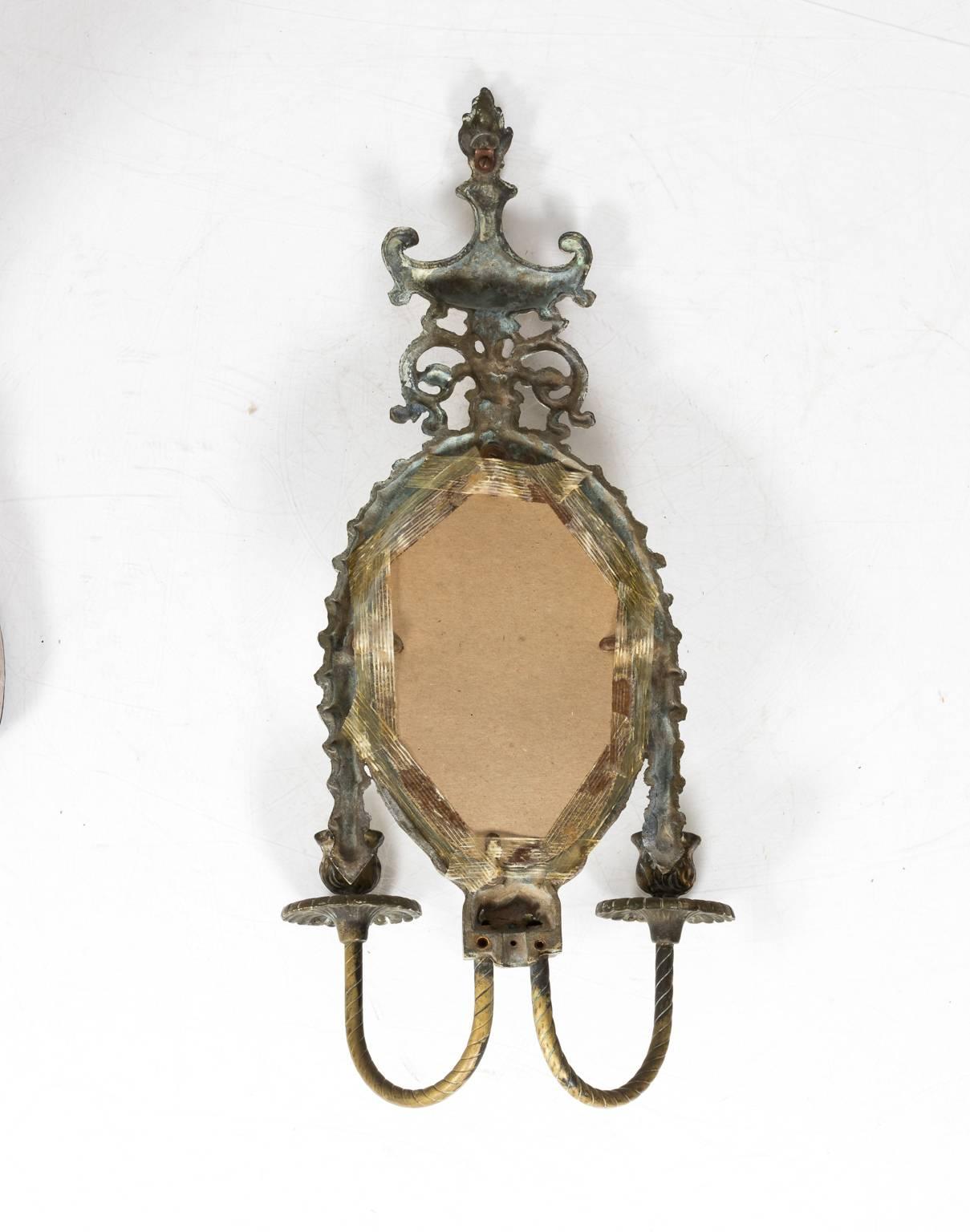 Pair of neoclassical style brass sconces with two arms, circa 19th century.
 