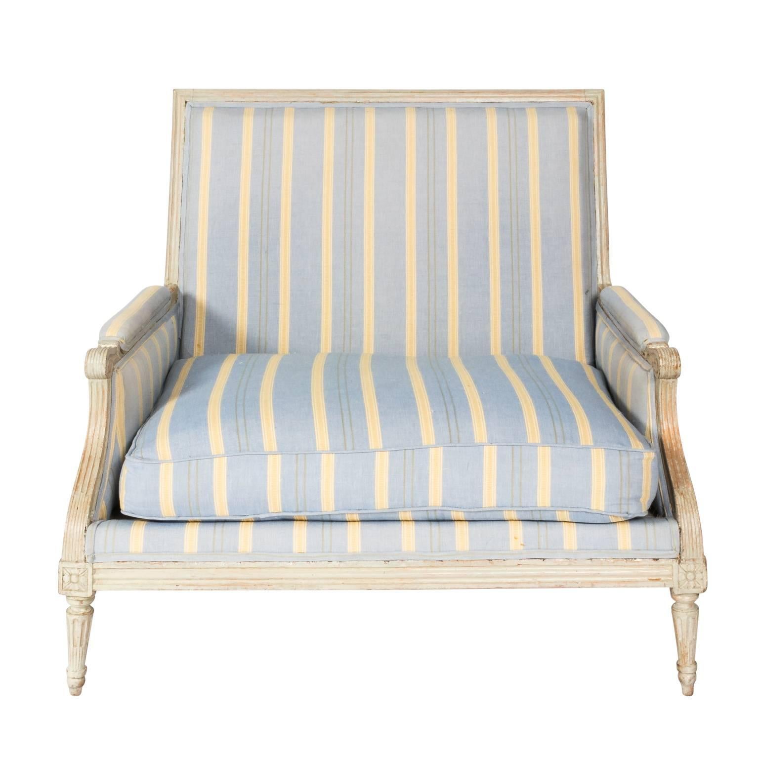 French white-painted marquis armchair, squared back, carved rosettes and ribbed detailing.
 