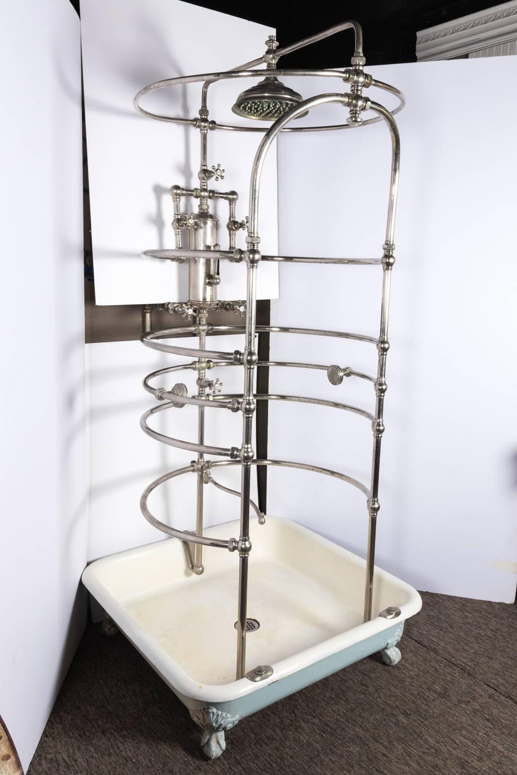Antique Victorian shower system with exposed piping. All original pieces and finish.
 