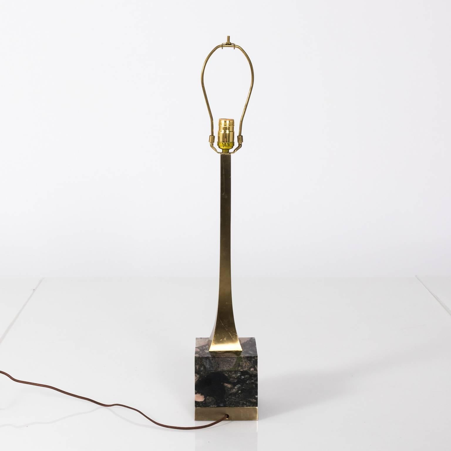 Mid-20th century brass column lamps on a marble base.
 