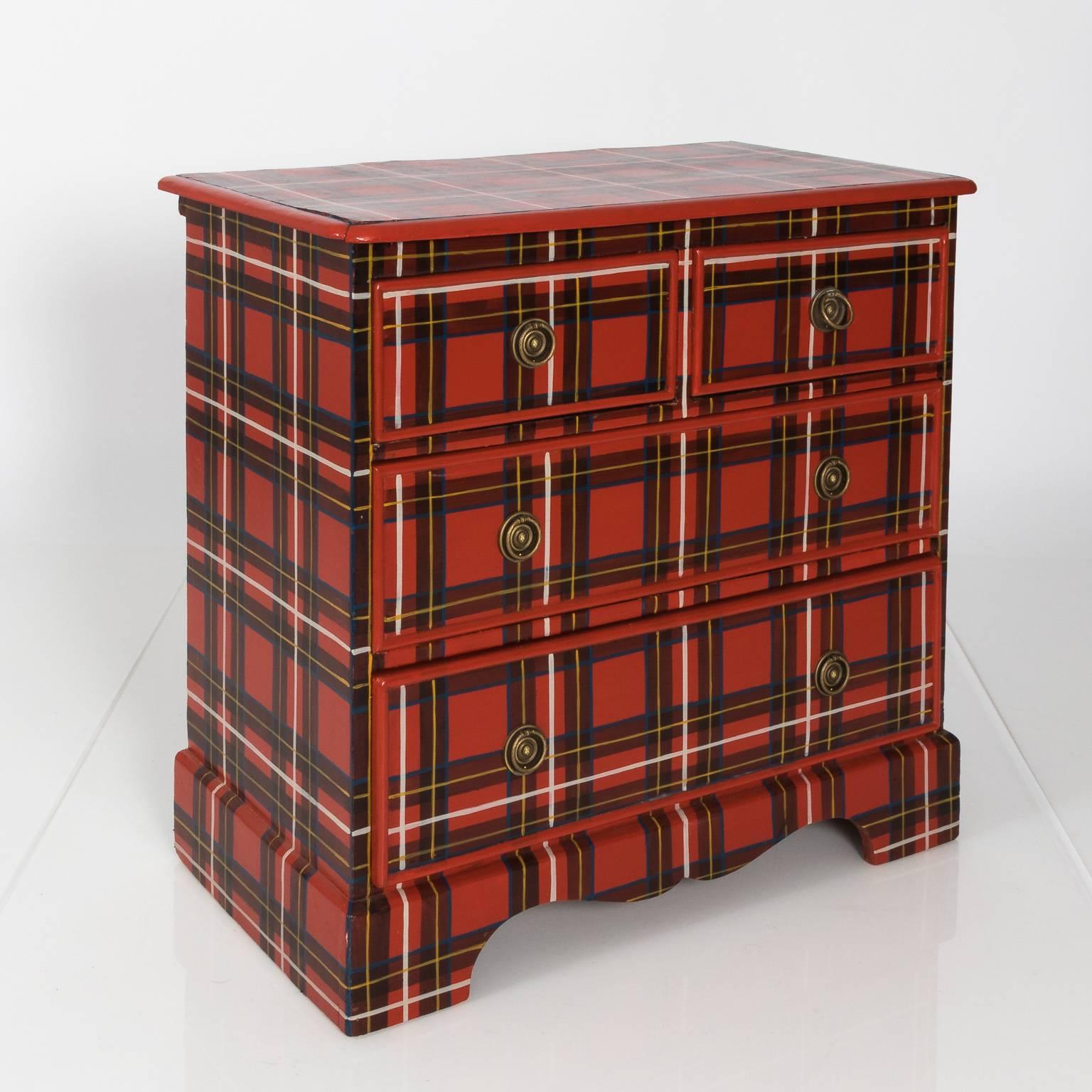 Victorian chest with four drawers in a custom plaid paint, circa late 19th century.
 