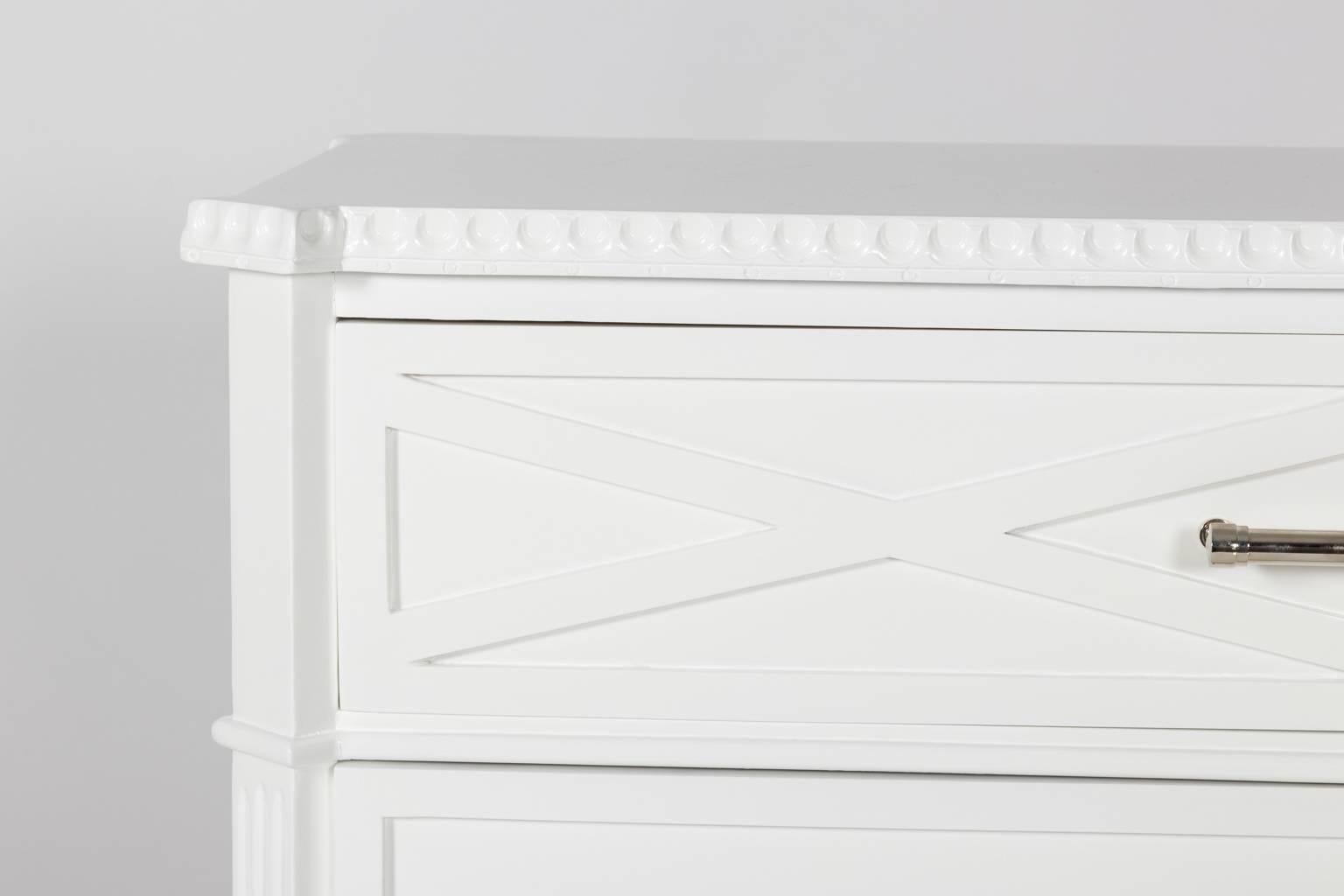  Contemporary pair of modern white lacquered commodes.

Can be purchased separately. 

