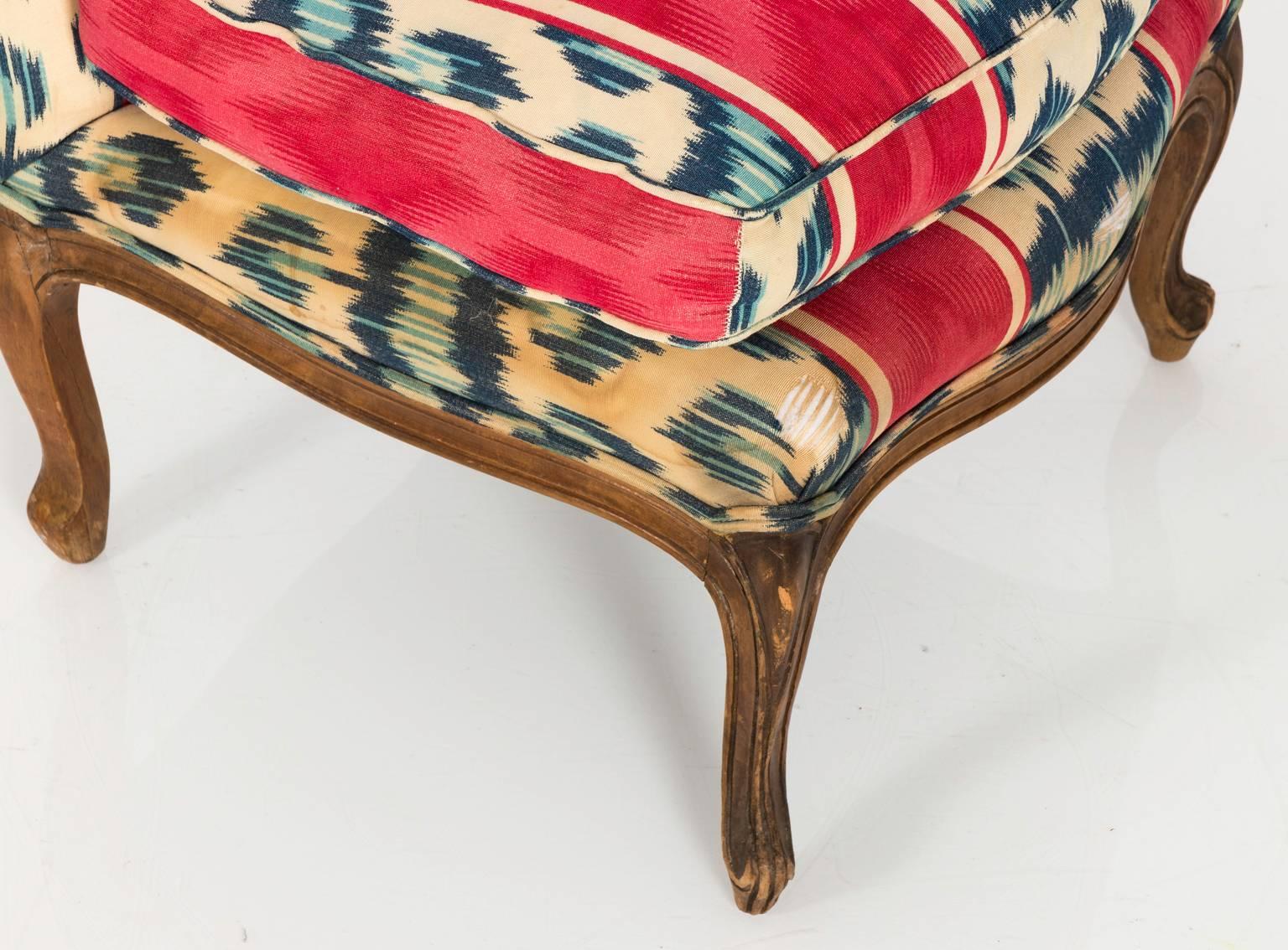Louis XVI style slipper chairs in a vintage custom fabric, circa early 20th century.