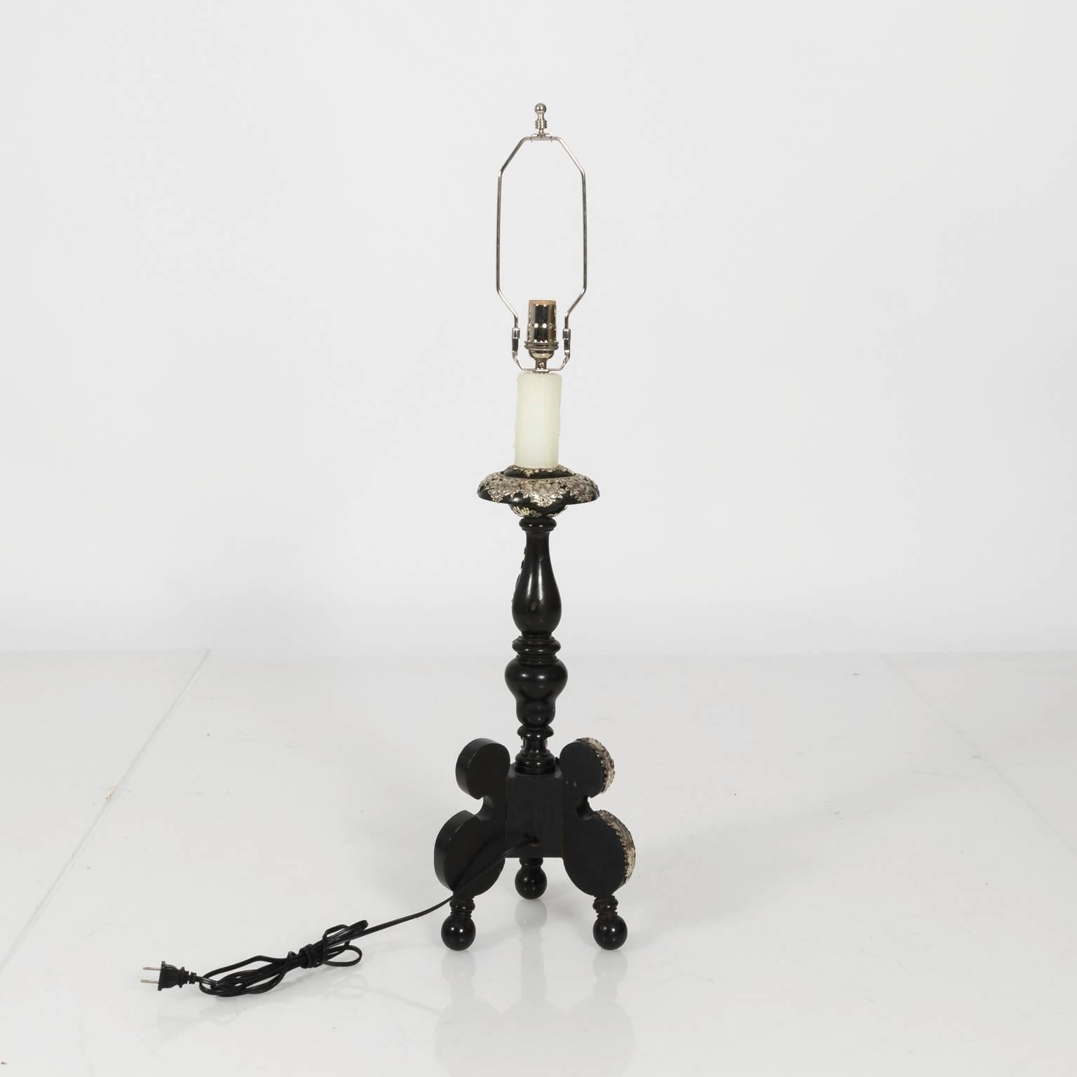 Pair of black Italian Rococo style lamps with decorative silver foliage overlay, circa 1920.