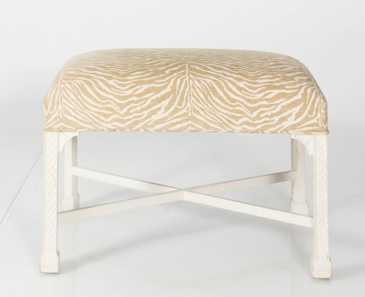 White painted Chinese Chippendale bench that features animal print upholstery and Marlborough legs, circa late 20th century.