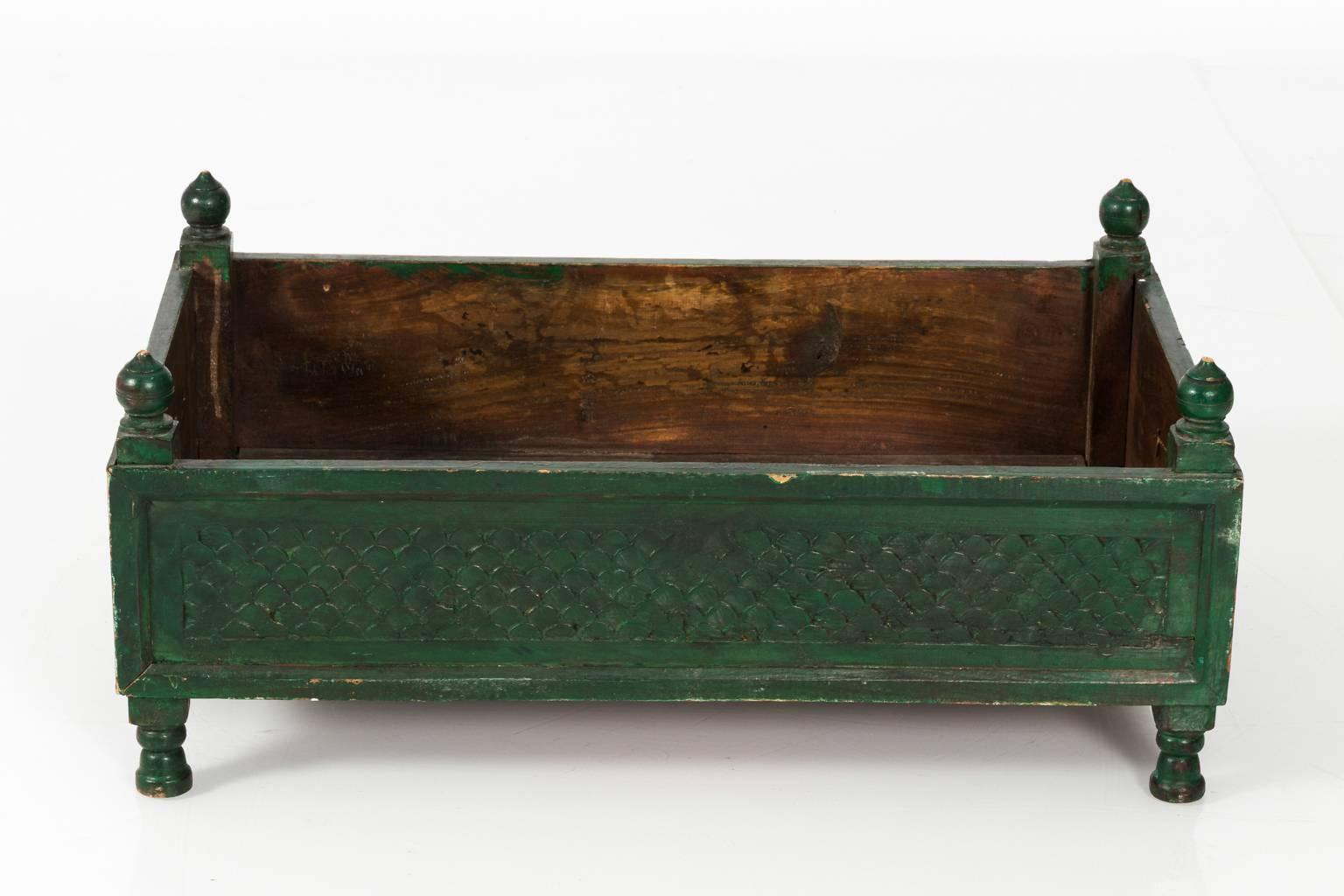 Green painted wood box with finials and fish scale carvings, circa early 20th century.
 