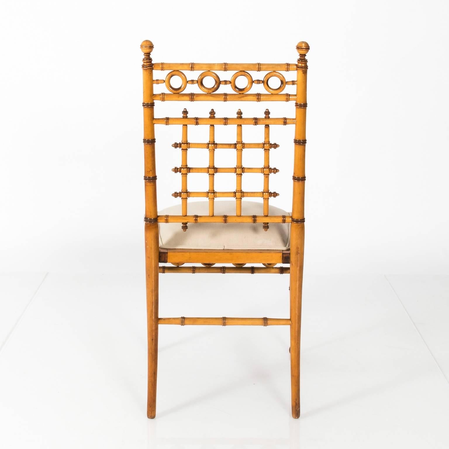 Faux bamboo chair by R.J. Horner Furniture Company with an upholstered seat, circa 1880.
 