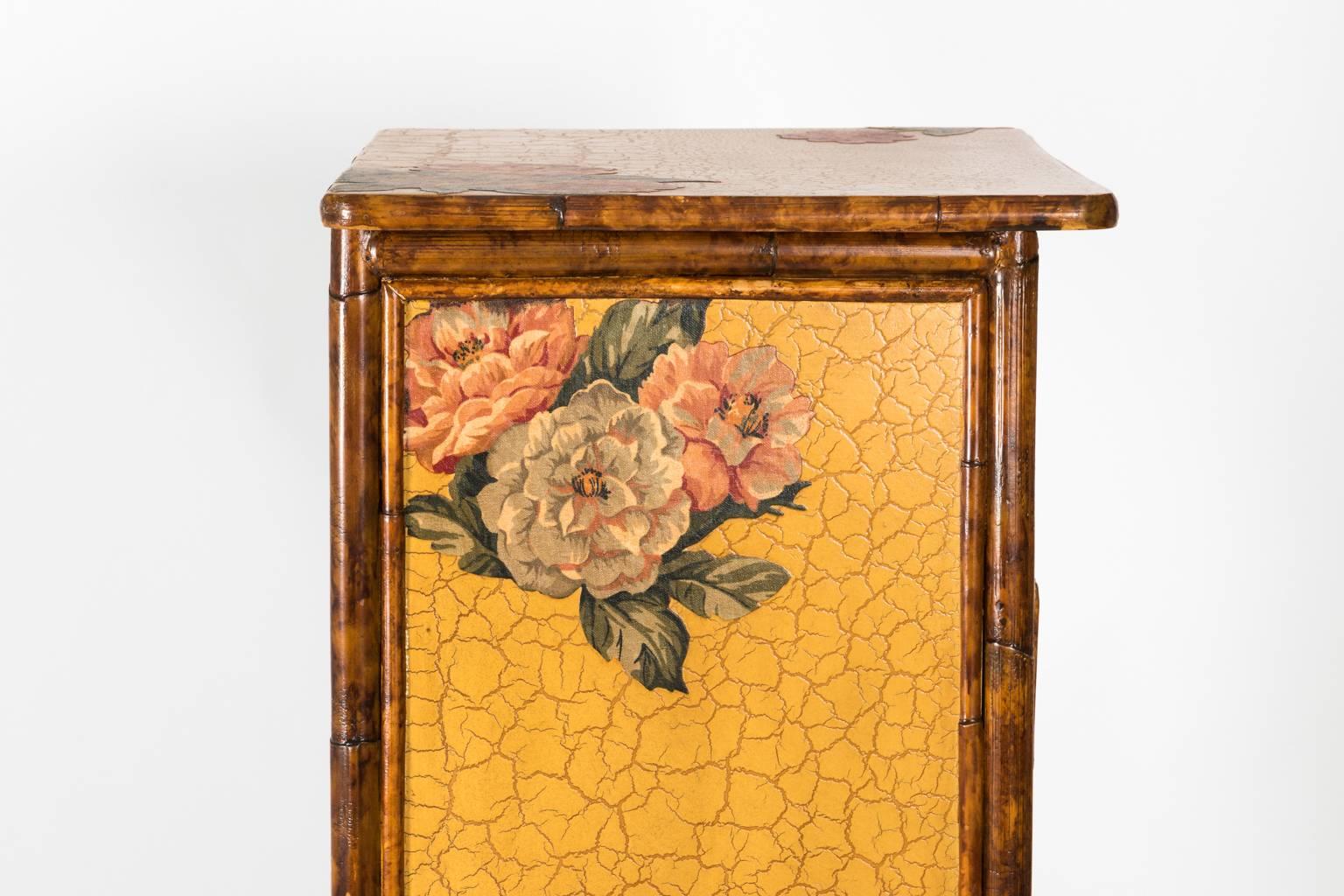 Tall lingerie chest dresser with seven drawers, circa 1940. The front also features painted and decoupaged flowers.
 