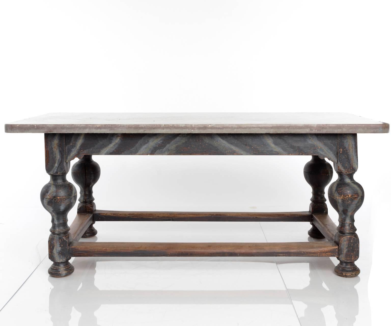 A large oak table with Oland stone top
and marbleized gray painted legs, side stretchers. 
Sweden, 18th-19th century.
 