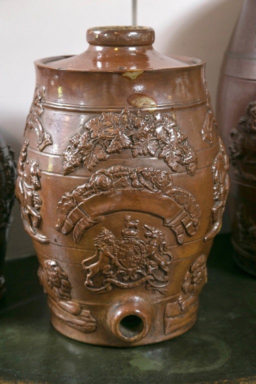 Each crock with a lid. Fully decorated on the front side, undecorated on the back, the English coat-of-arms flanked on each with knights on horseback. Probably made for water or ale. Diameters and heights of each 8 x 10.5/ 
10 x 12.5/ 16.25 x 12.