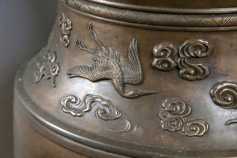 Probably dating from the Meiji period, this bronze has deep relief figures and adornments of birds, trees and clouds. Extremely fine detailing.