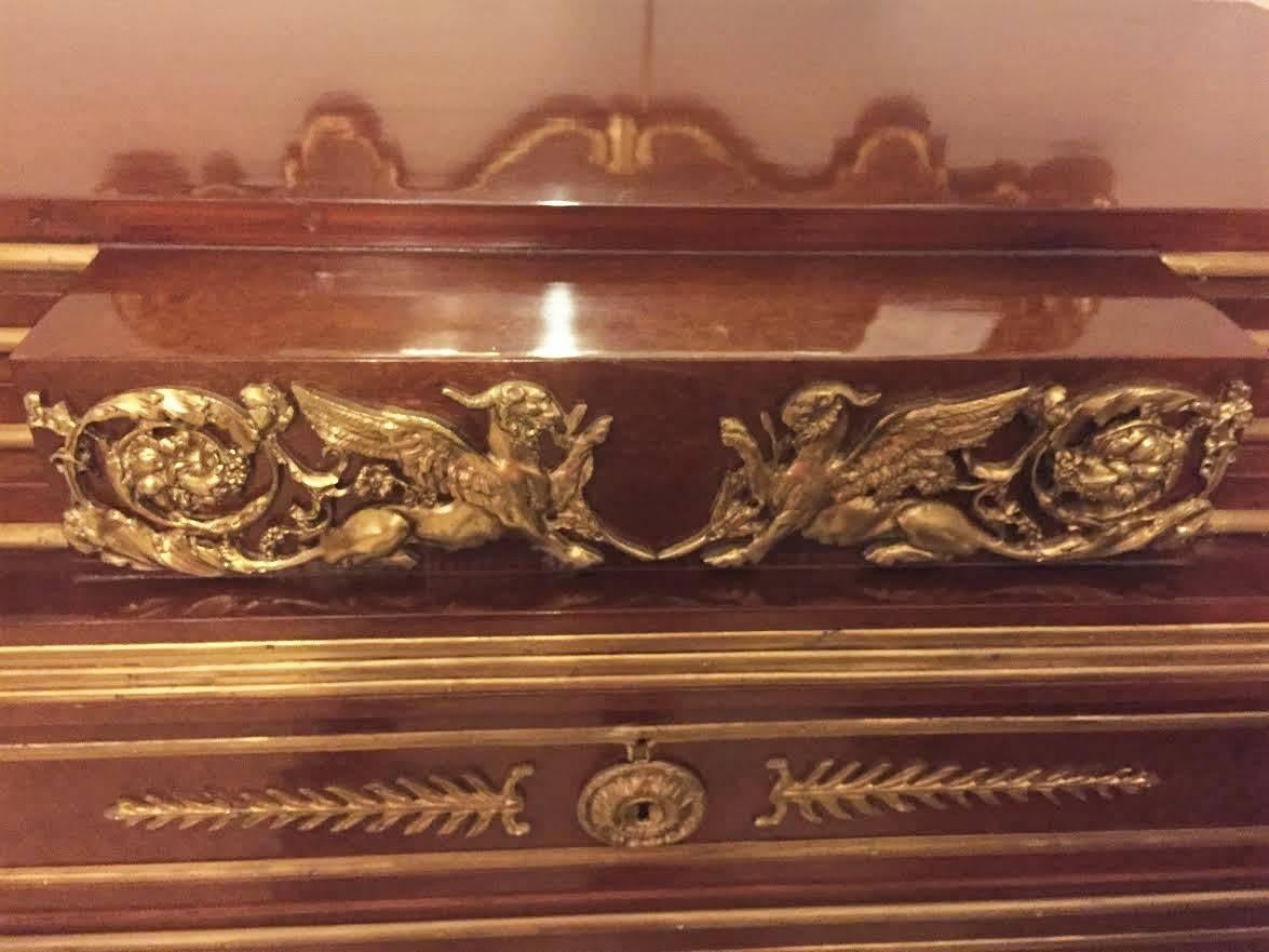 Pair of three-drawer four high step up Russian neoclassical style chest or commodes. Each finely bronze-mounted commode or nightstand having the Louis XVI flair is supported on turned legs with bronze mounted reeded sides and all-over bronze design.