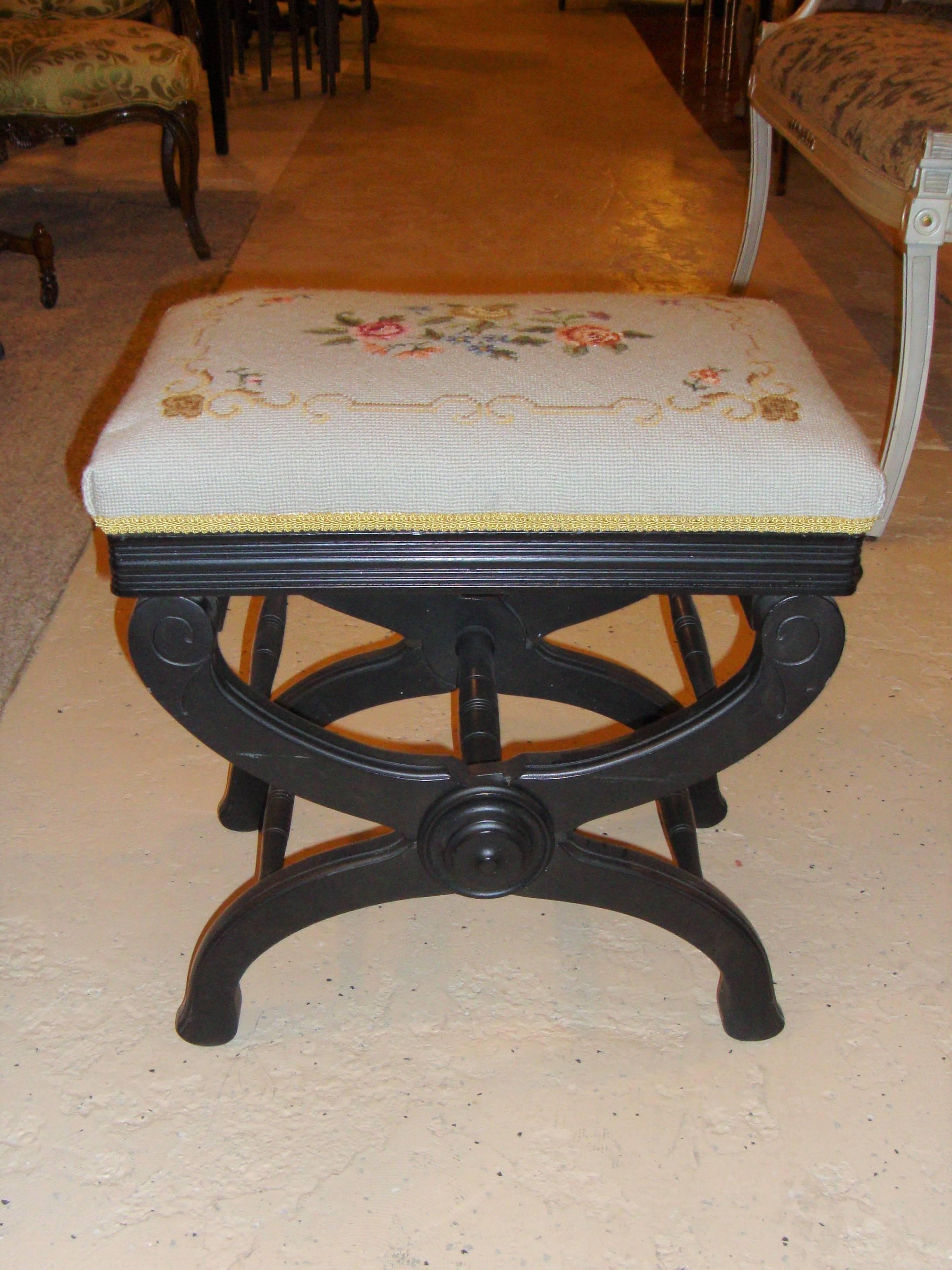 A fine and rare Antique Ajustable Victorian Bench in ebony finish with hand embroidered seat.  Circa 1880s 
