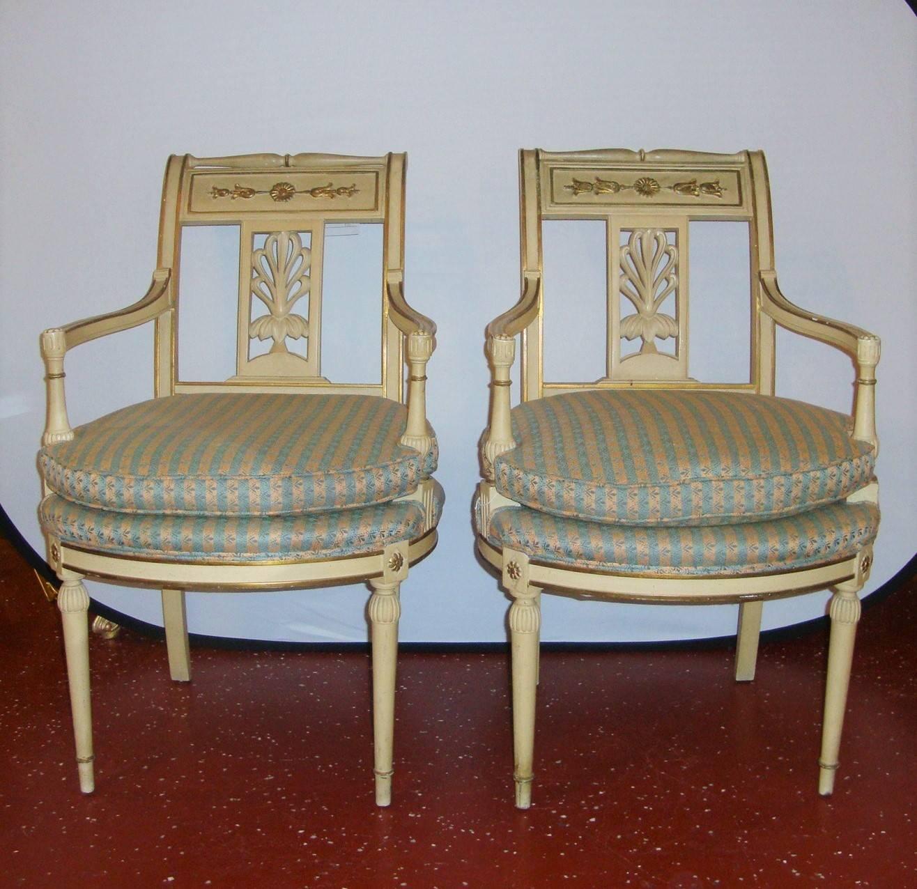 A gorgeous pair or creme paint chars in an Empire Style. These chairs have beautiful guilt details throughout.

 