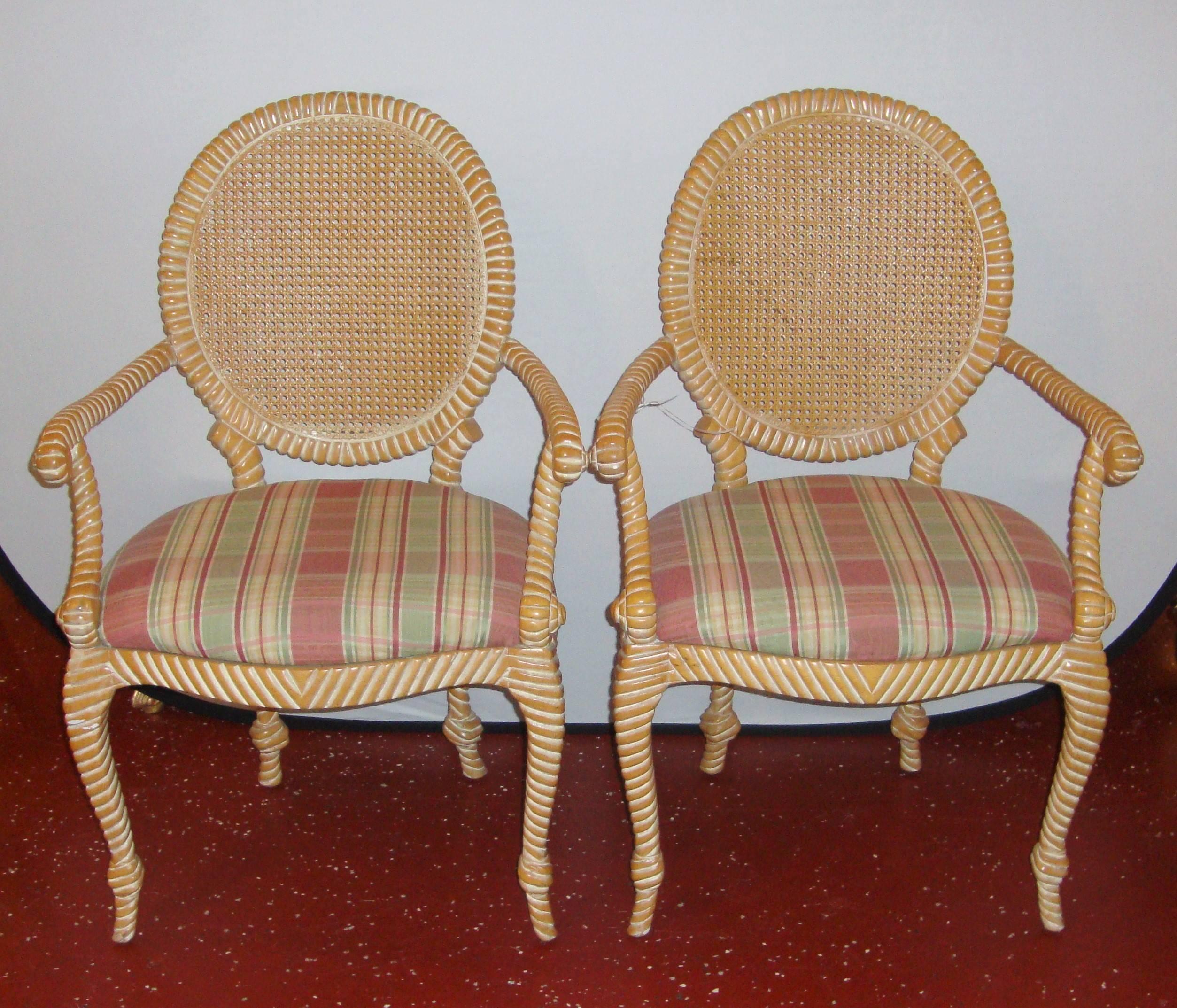 A gorgeous pair of twisted armchairs, with cane backs. With plaid patterned upholstery.