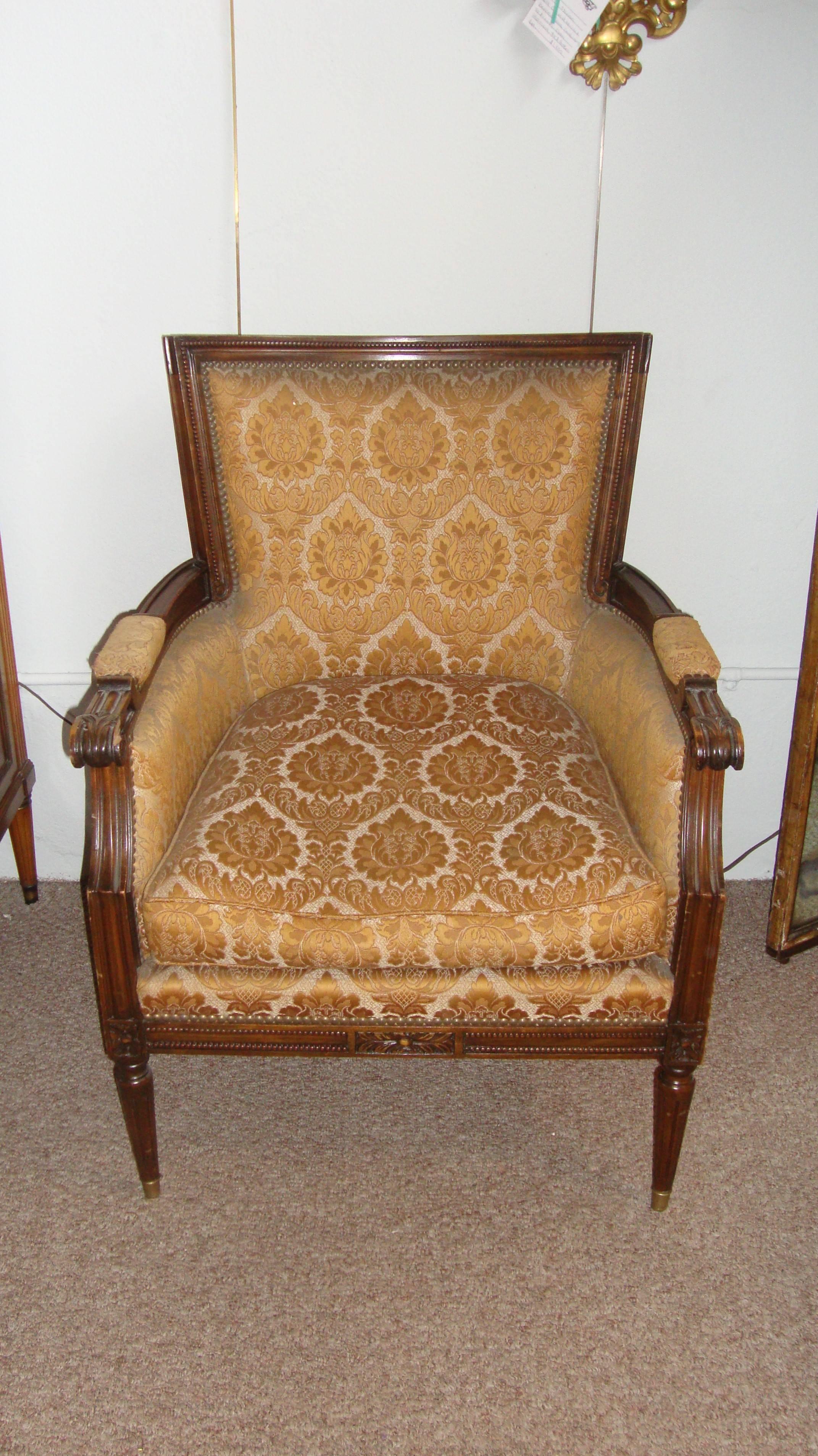 Pair Of Louis XVI Style Bergere Arm Office Chairs Manner Of Jansen with brass cap feet, floral motif fabric.
 
Made in France this pair having strong sturdy frames in the Louis XVI Fashion. Each with a wide broad C shaped back, the pair have